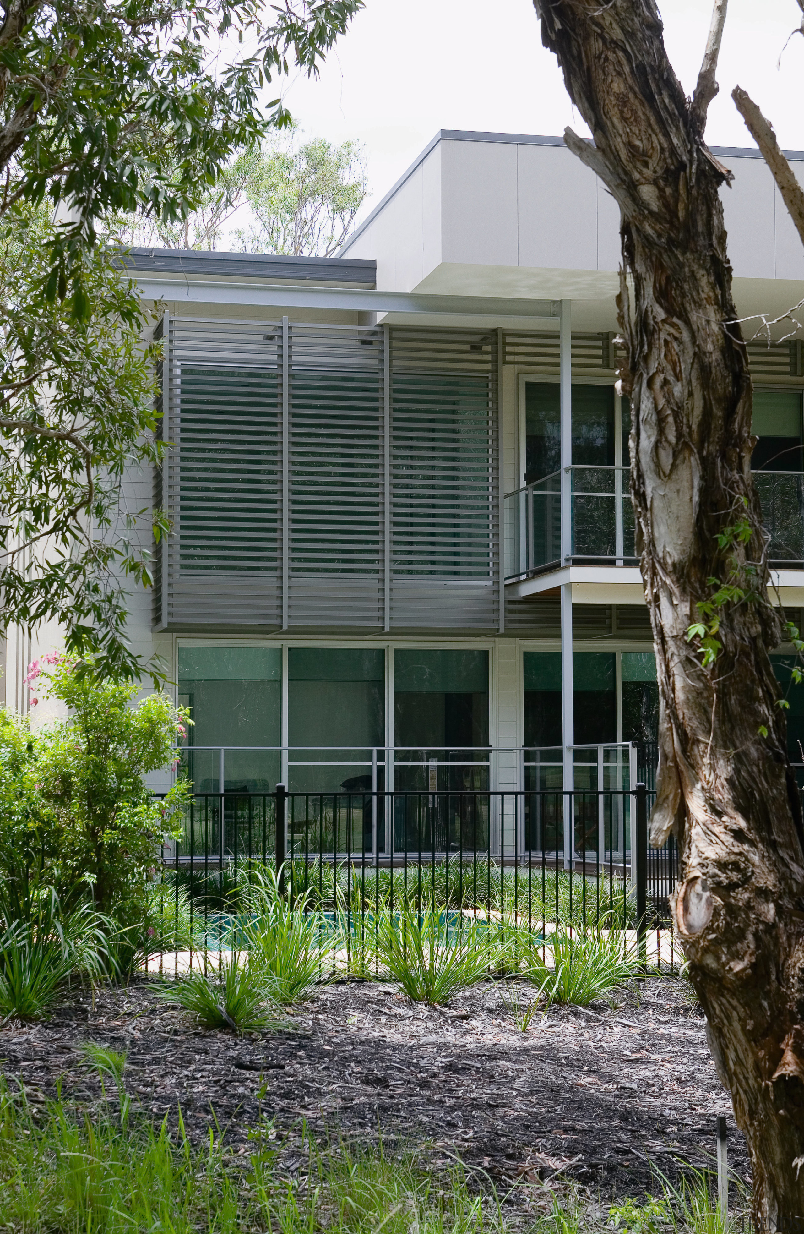 A view of some balustardes by Aluminium Balustrades. architecture, building, cottage, facade, home, house, property, real estate, residential area, siding, tree, window, gray, black