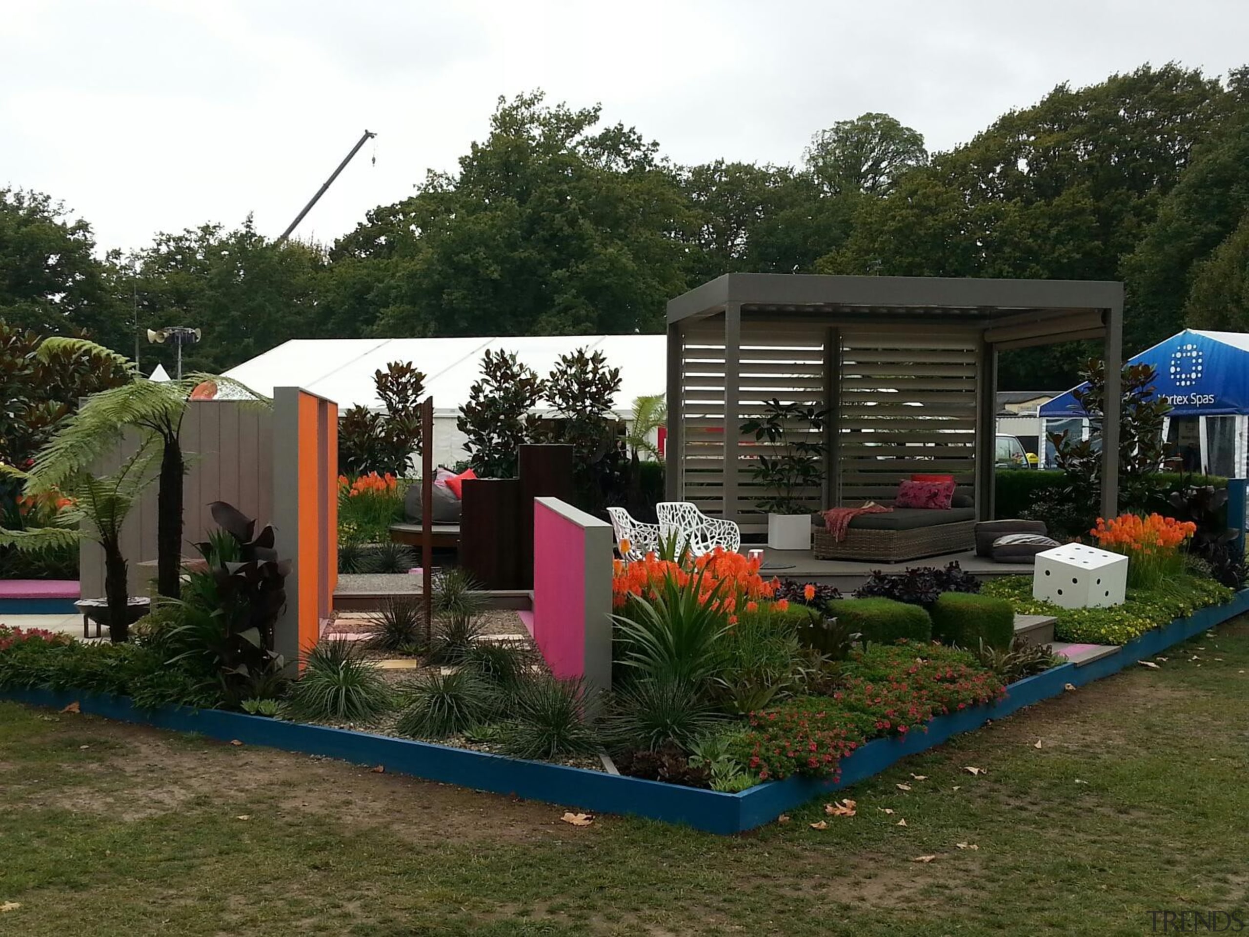 The Louvretec stand at the Ellerslie Flower Show backyard, canopy, garden, house, outdoor structure, plant, real estate, recreation, roof, shed, tree, yard, brown