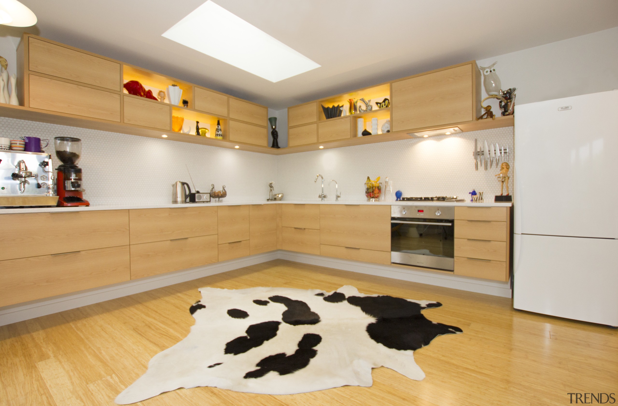 Cantilevered cabinetry is a feature of this kitchen floor, flooring, interior design, kitchen, room, gray, orange