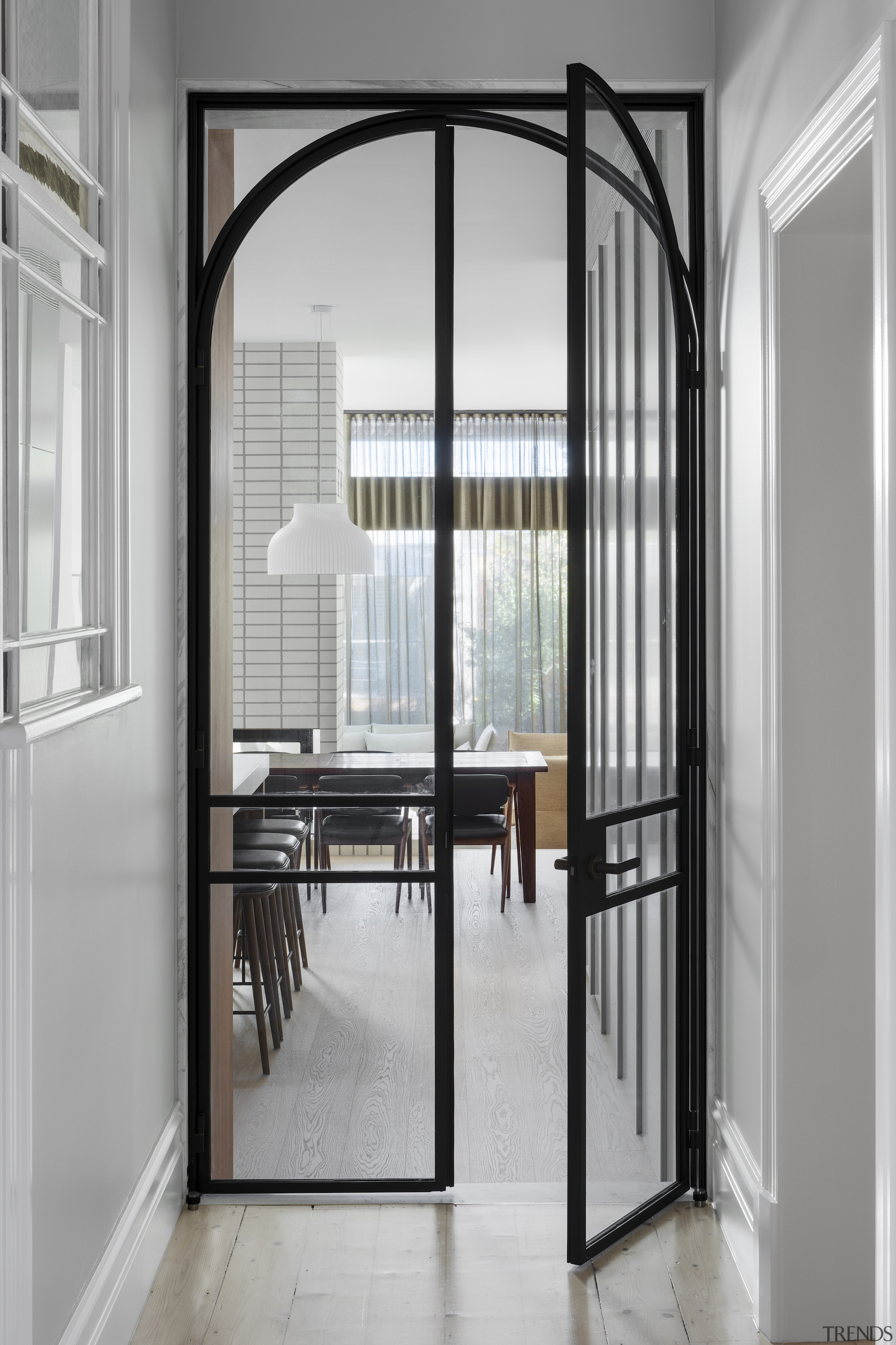 Steel-framed, arched doors make for a suitable approach 