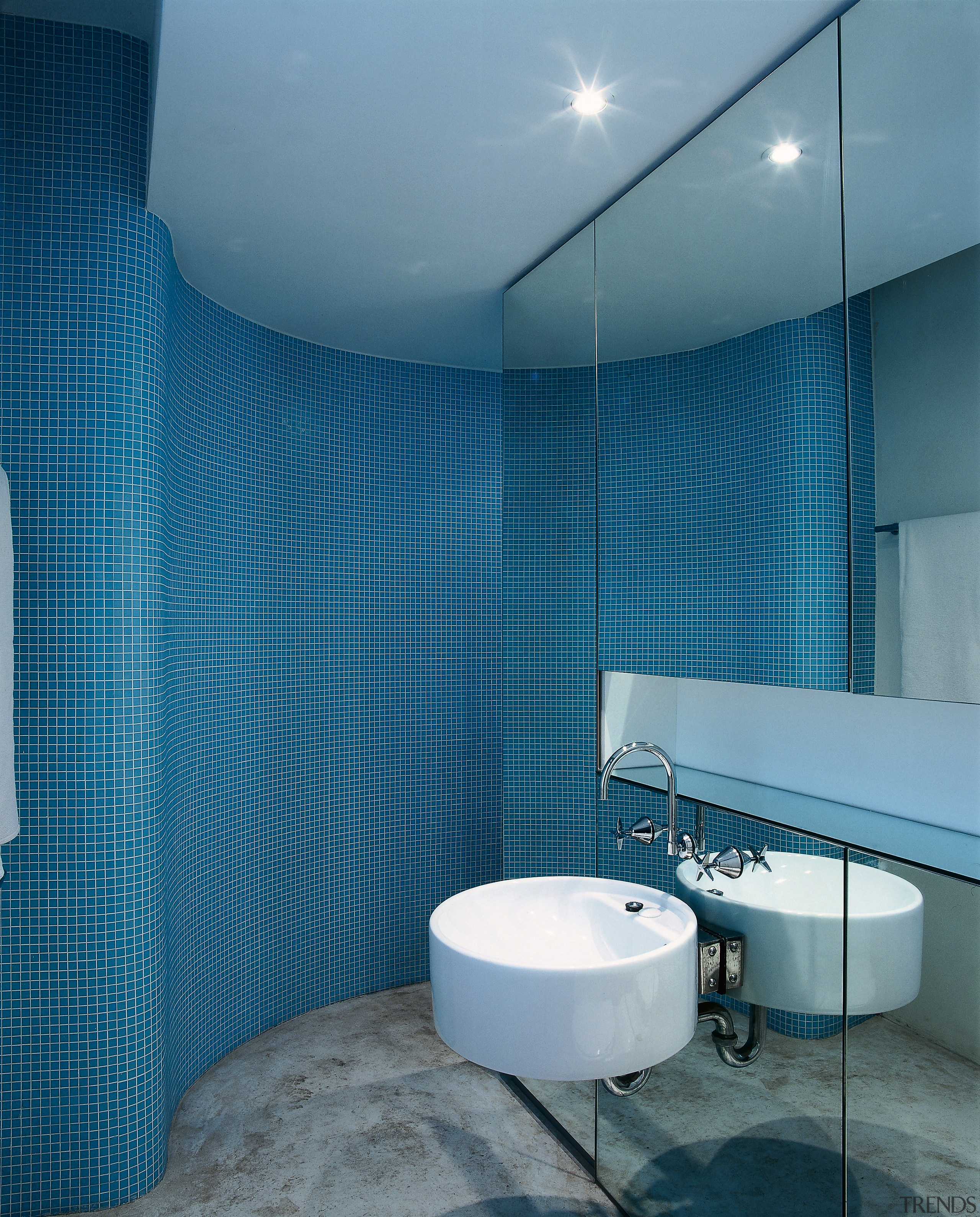 The view of an ensuite with a curved architecture, bathroom, blue, ceiling, daylighting, daytime, floor, glass, interior design, product design, room, tile, wall, teal, blue