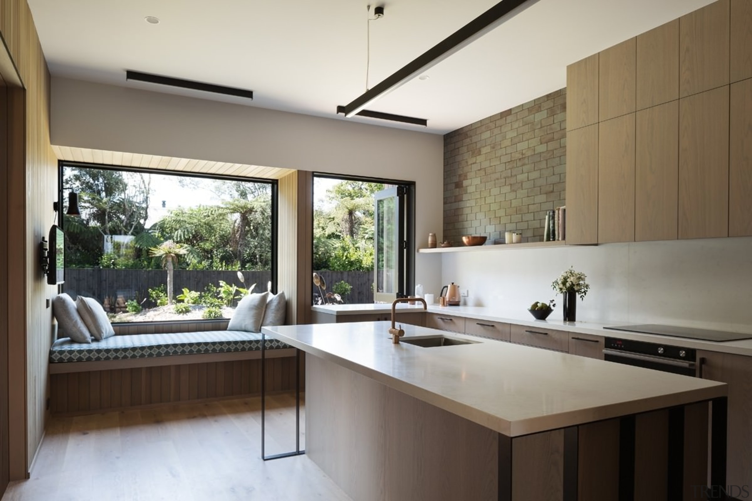 The kitchen is spacious and filled with natural architecture, countertop, house, interior design, kitchen, real estate, window, white