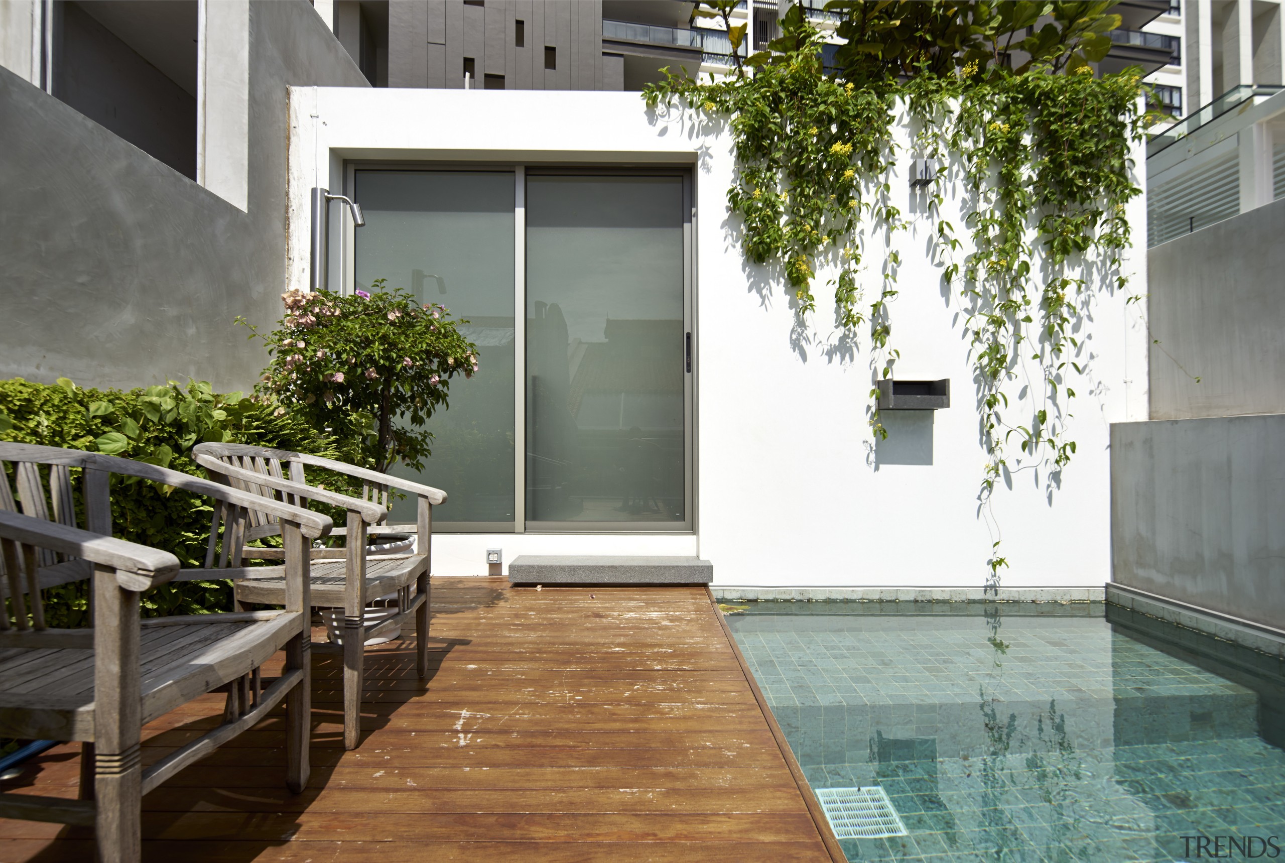 A rooftop deck and swimming pool are located apartment, architecture, backyard, condominium, courtyard, facade, home, house, interior design, property, real estate, residential area, swimming pool, water, window, gray