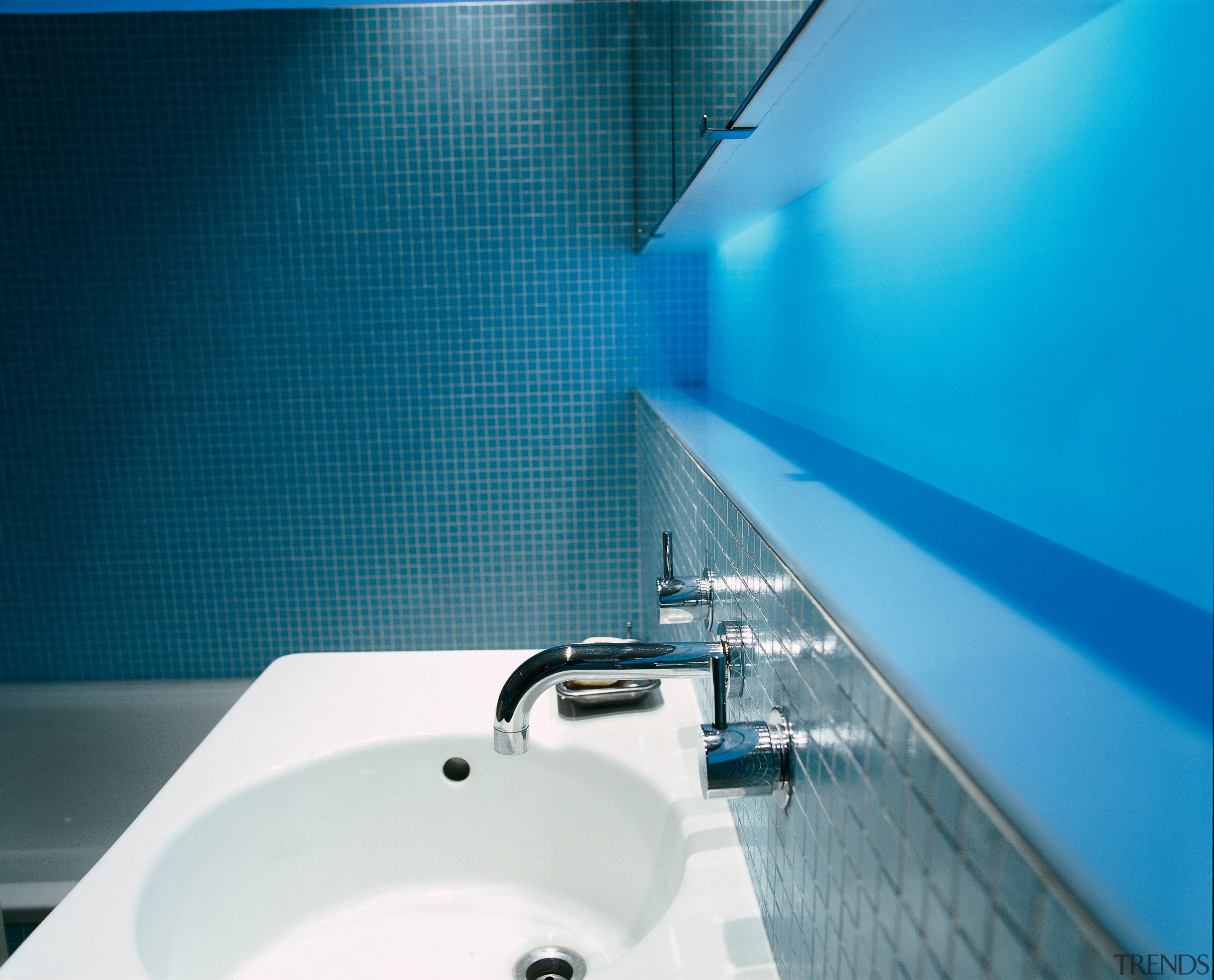 View of sink and faucetry in the bathroom. bathroom, blue, plumbing fixture, product design, teal