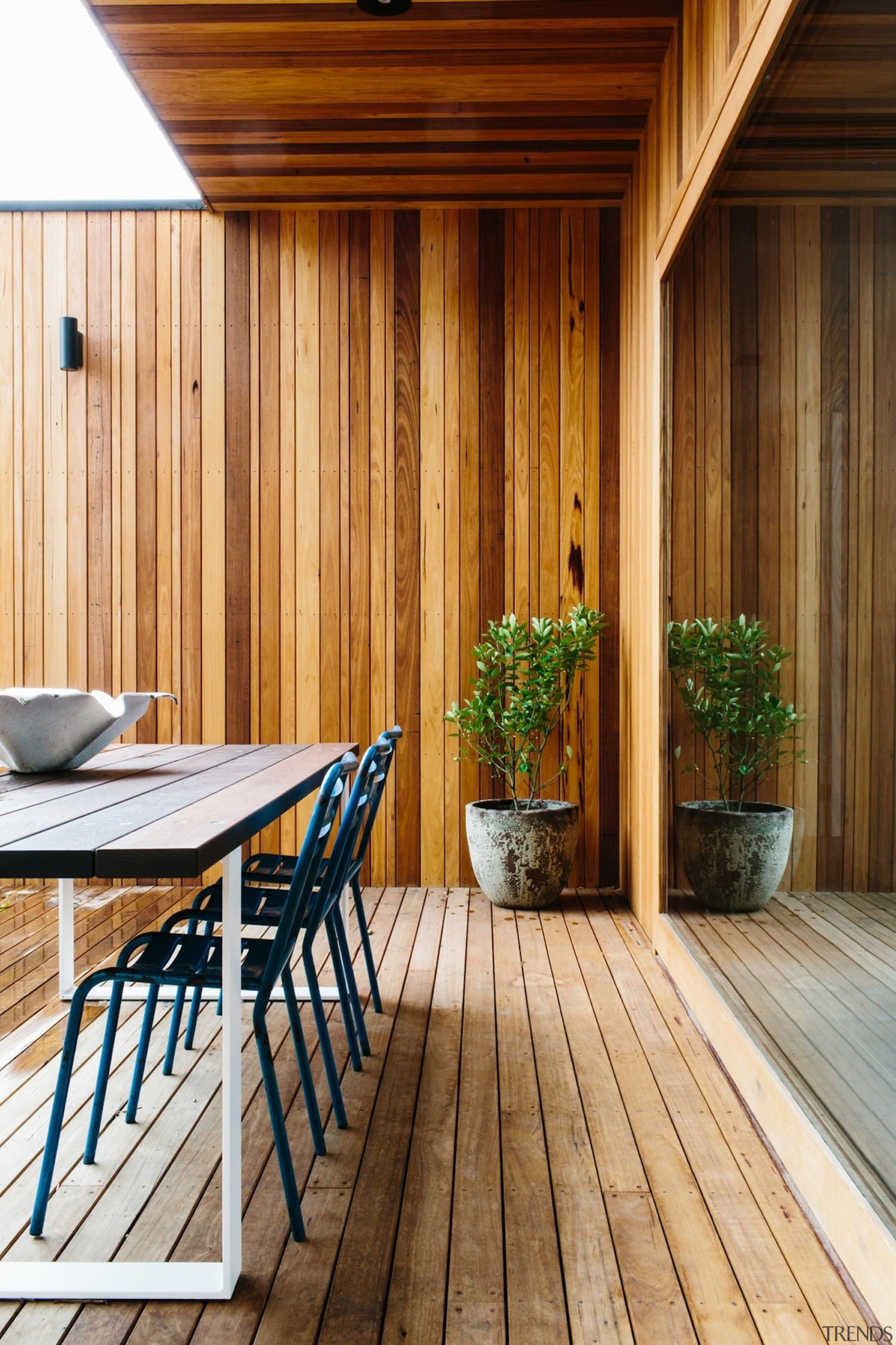 A timber deck stands apart from the walls architecture, deck, floor, hardwood, home, house, interior design, real estate, siding, wood, wood flooring, wood stain, brown, orange