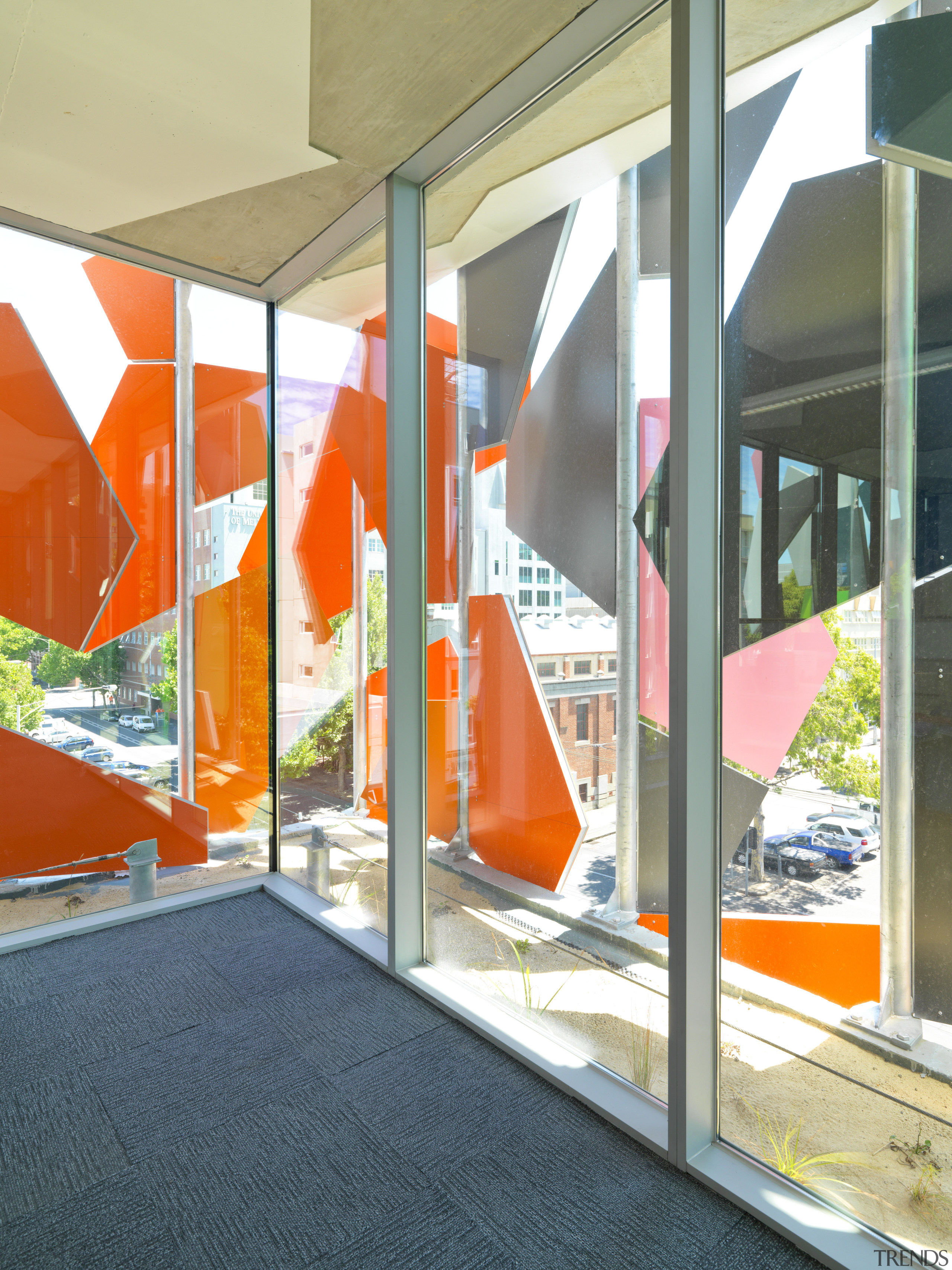 View of Pixel Building, with colorful exterior flags, architecture, glass, interior design, window