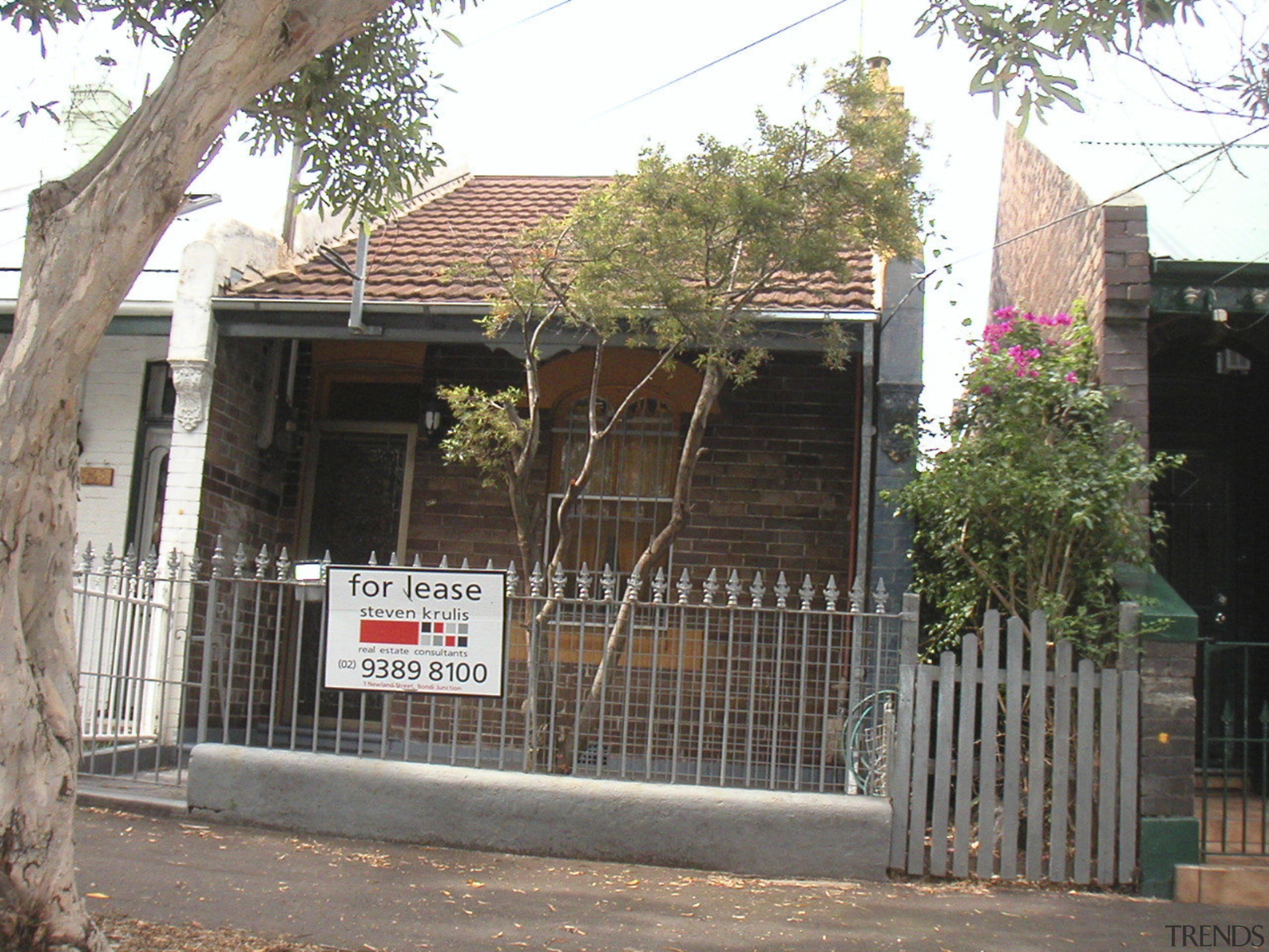 Exterior view of the front of the house area, building, facade, gate, home, house, neighbourhood, property, real estate, residential area, tree, gray