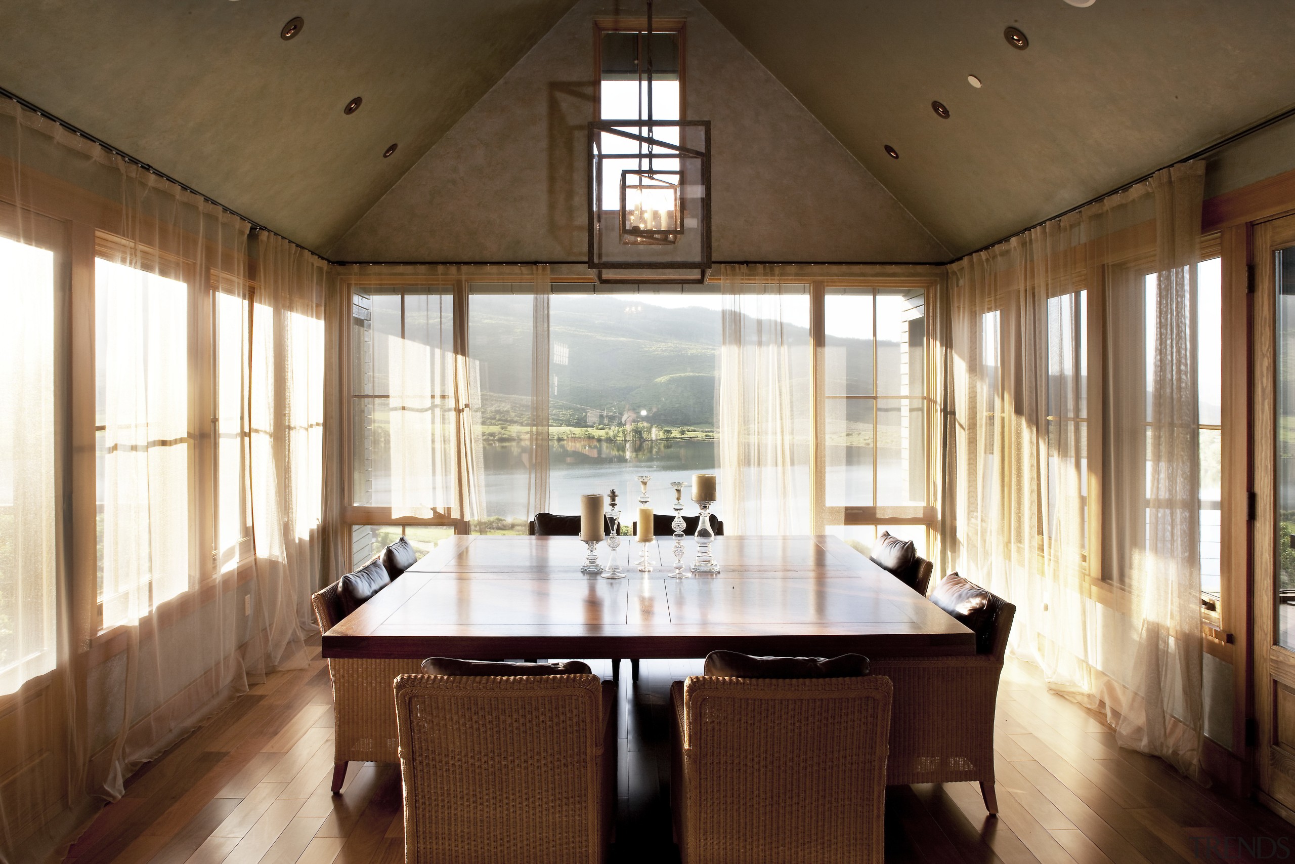 A view of a home designed by Tim architecture, ceiling, dining room, estate, house, interior design, real estate, room, table, window, wood, brown, white