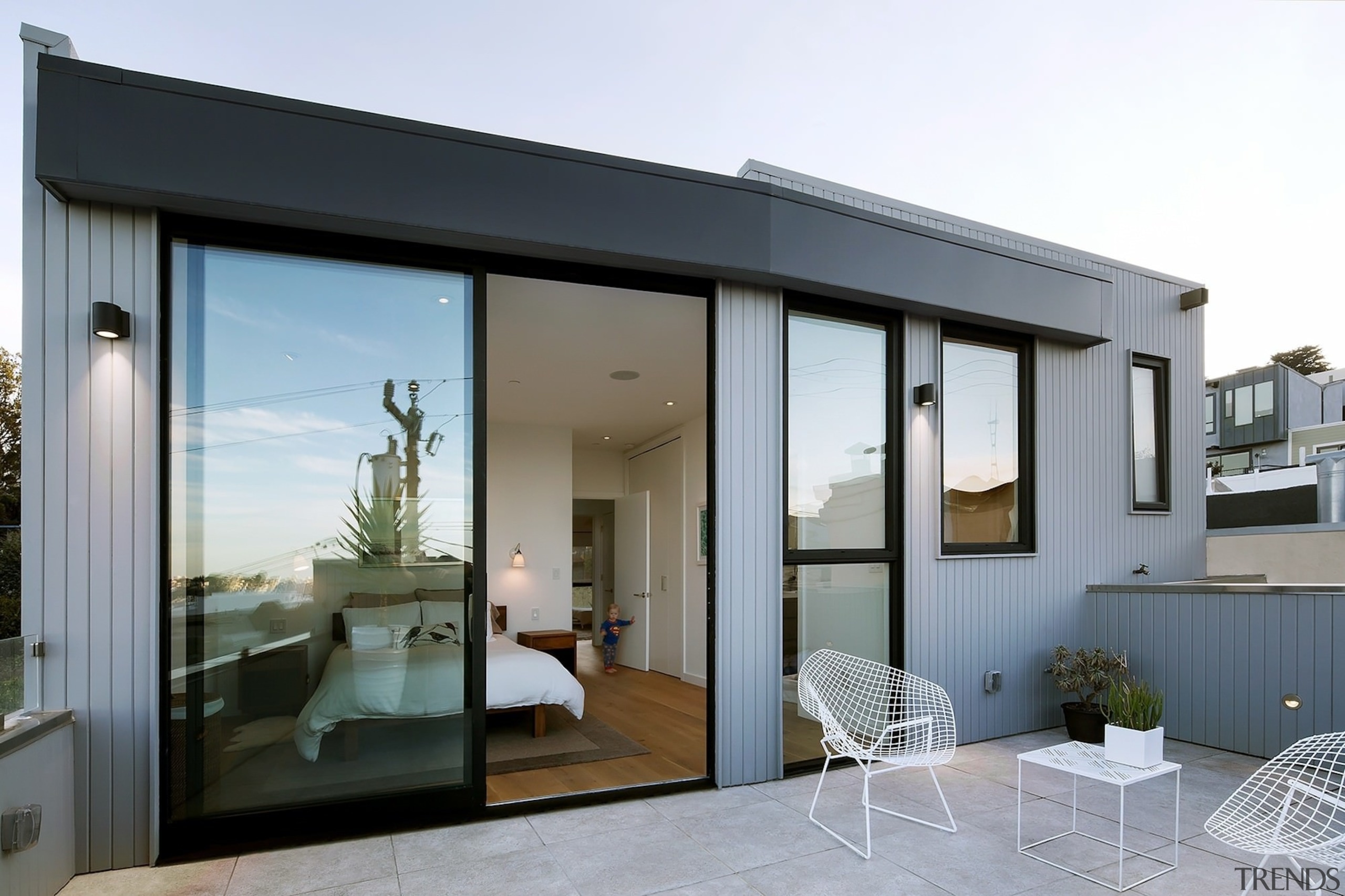 The master bedroom opens out onto a spacious architecture, door, facade, home, house, interior design, property, real estate, window, white