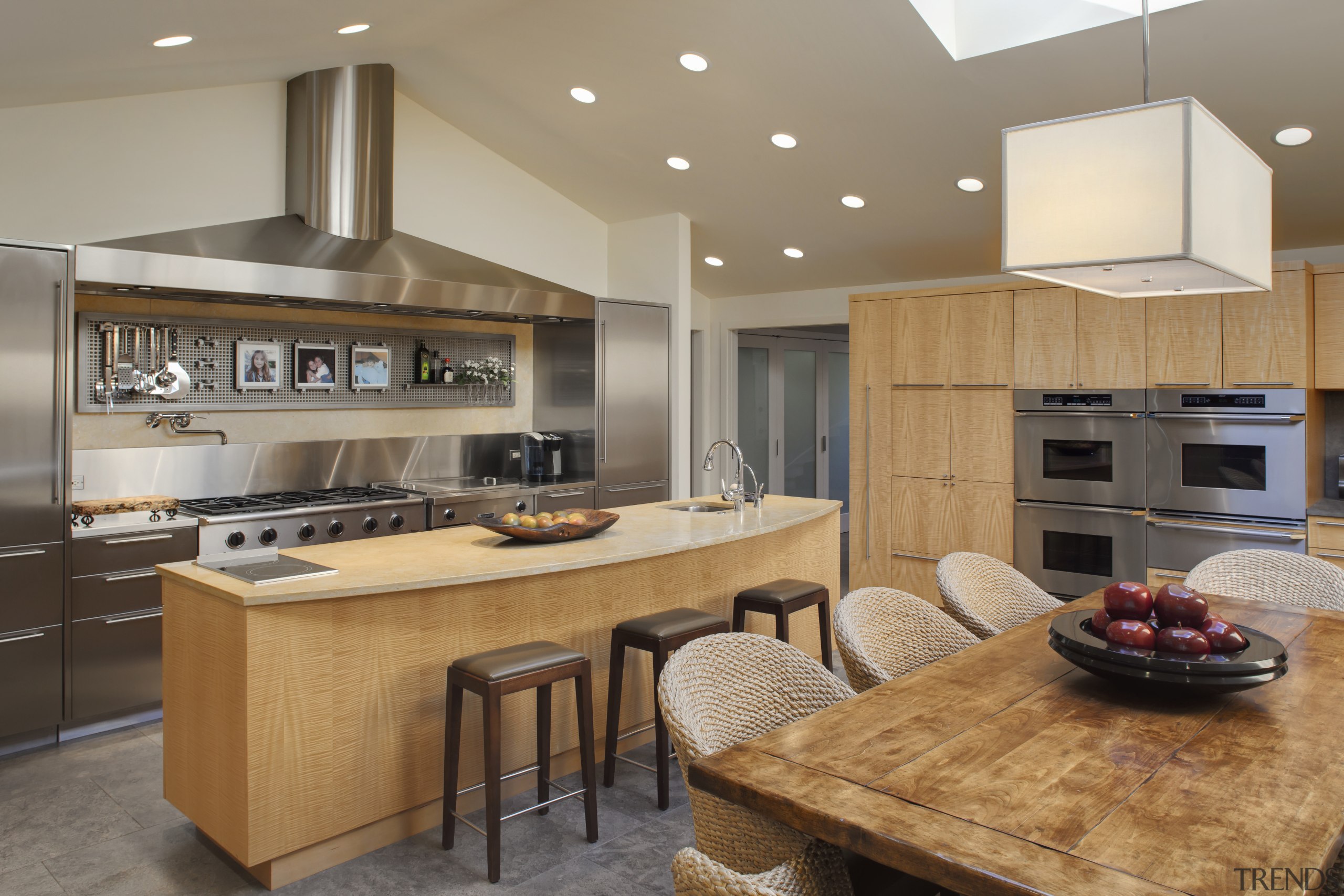 View of kitchen with wooden cabinetry and island cabinetry, countertop, cuisine classique, interior design, kitchen, real estate, room, gray