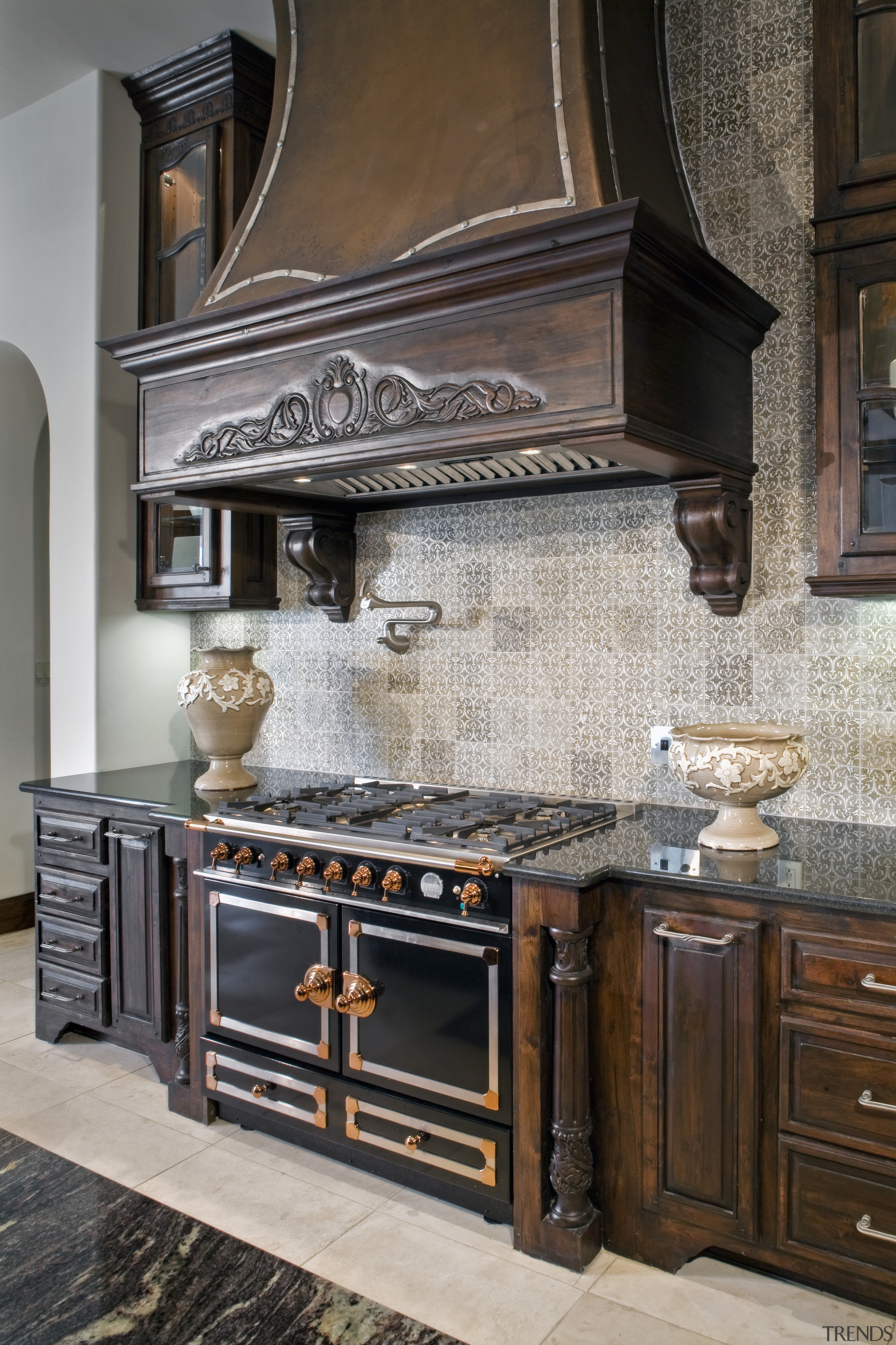 This Kitcehn features slightly distressed teak wood cabinetry cabinetry, countertop, cuisine classique, fireplace, floor, flooring, furniture, home appliance, interior design, kitchen, kitchen appliance, kitchen stove, room, tile, wood stain, gray, black