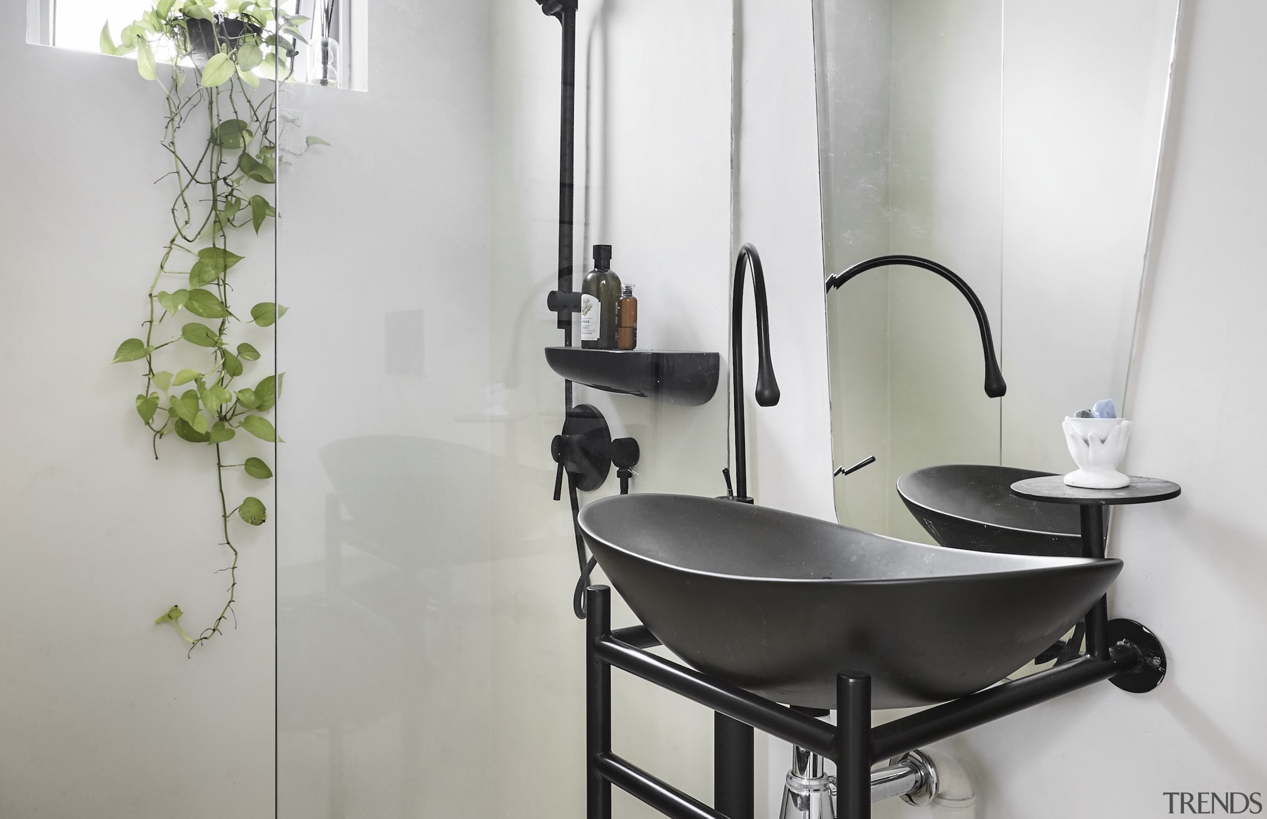 Sculptural washstand meets sculptural wall mirror. 