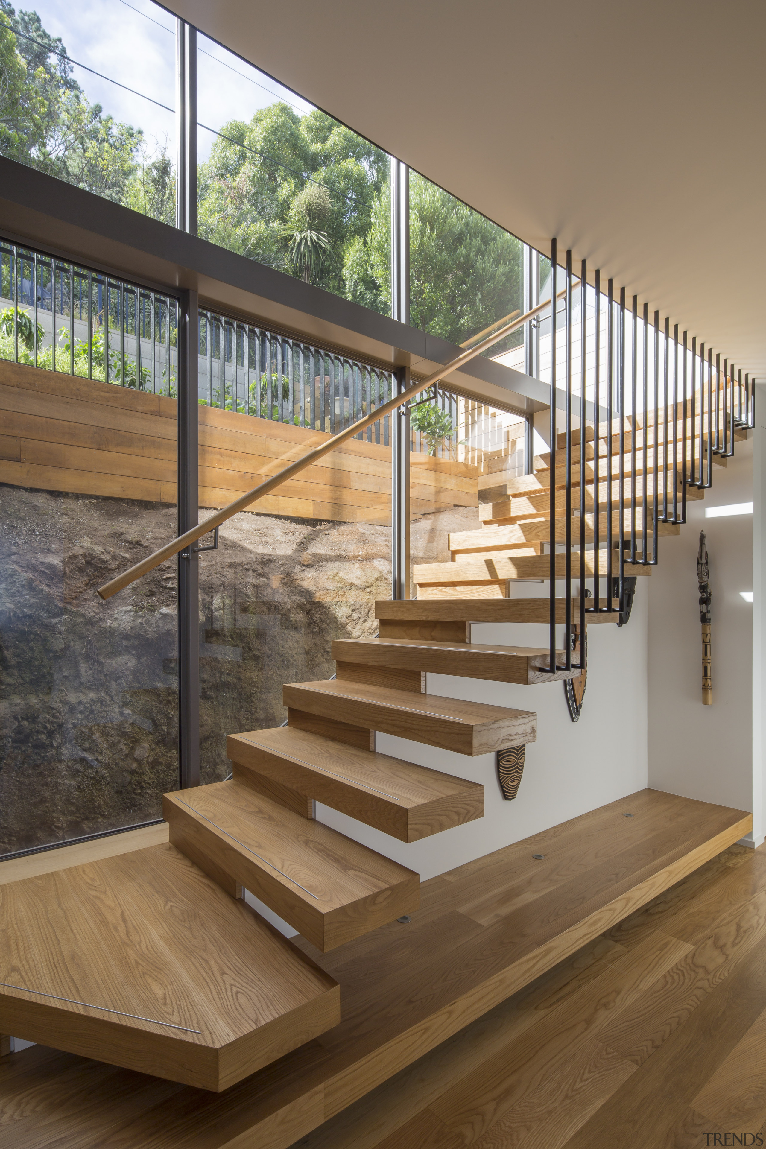 ​​​​​​​A timber-tread, cantilevered feature stair provides vertical access brown