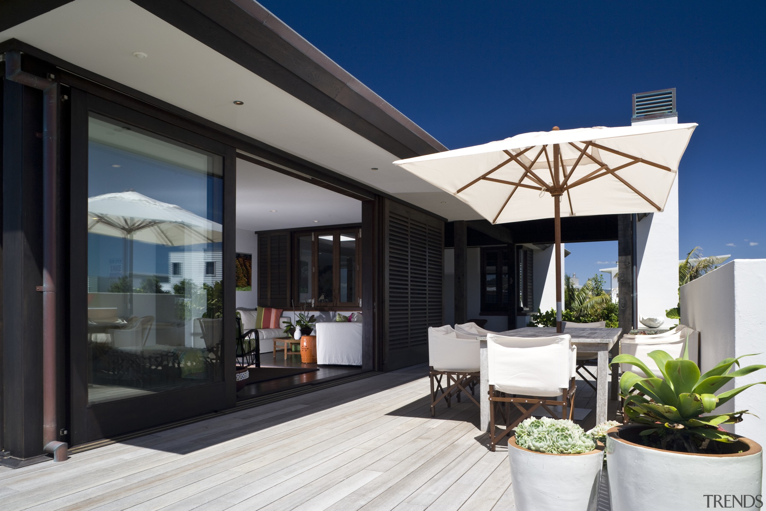 Exterior view of the side of the bach home, house, interior design, property, real estate, roof, window, black, white