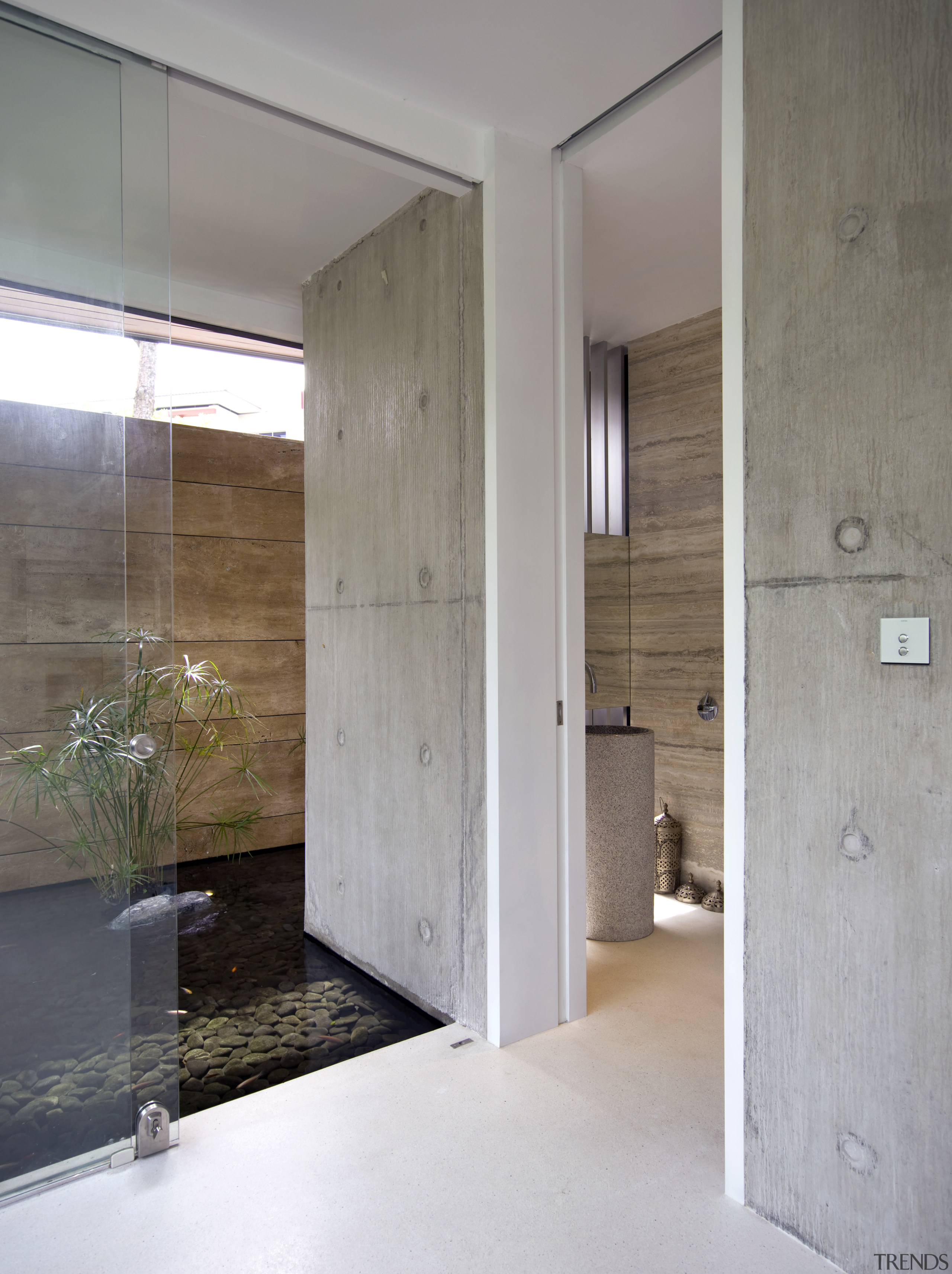 View of the doorway to the powder room architecture, door, floor, house, interior design, wall, wood, gray