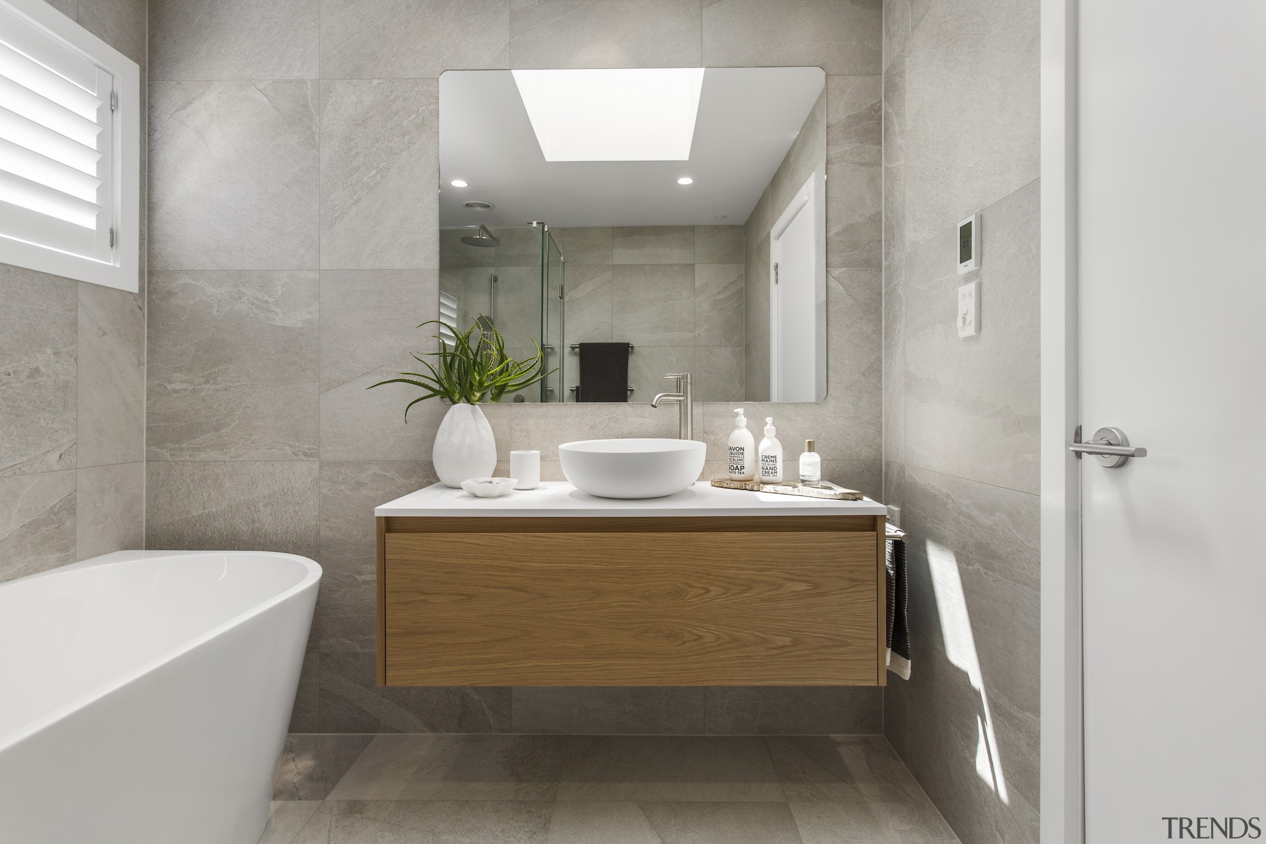 Cantilevering the vanity and exposing the floor beneath 