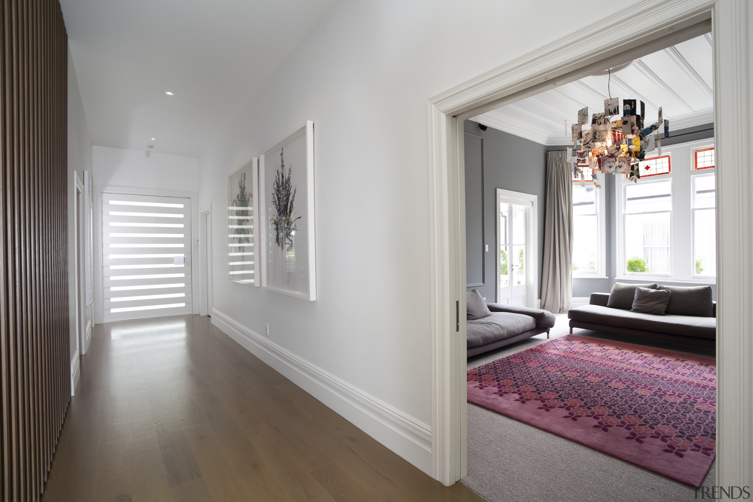 The original wide hallway remains a key feature ceiling, door, estate, floor, flooring, hardwood, home, house, interior design, laminate flooring, property, real estate, room, window, wood, wood flooring, gray