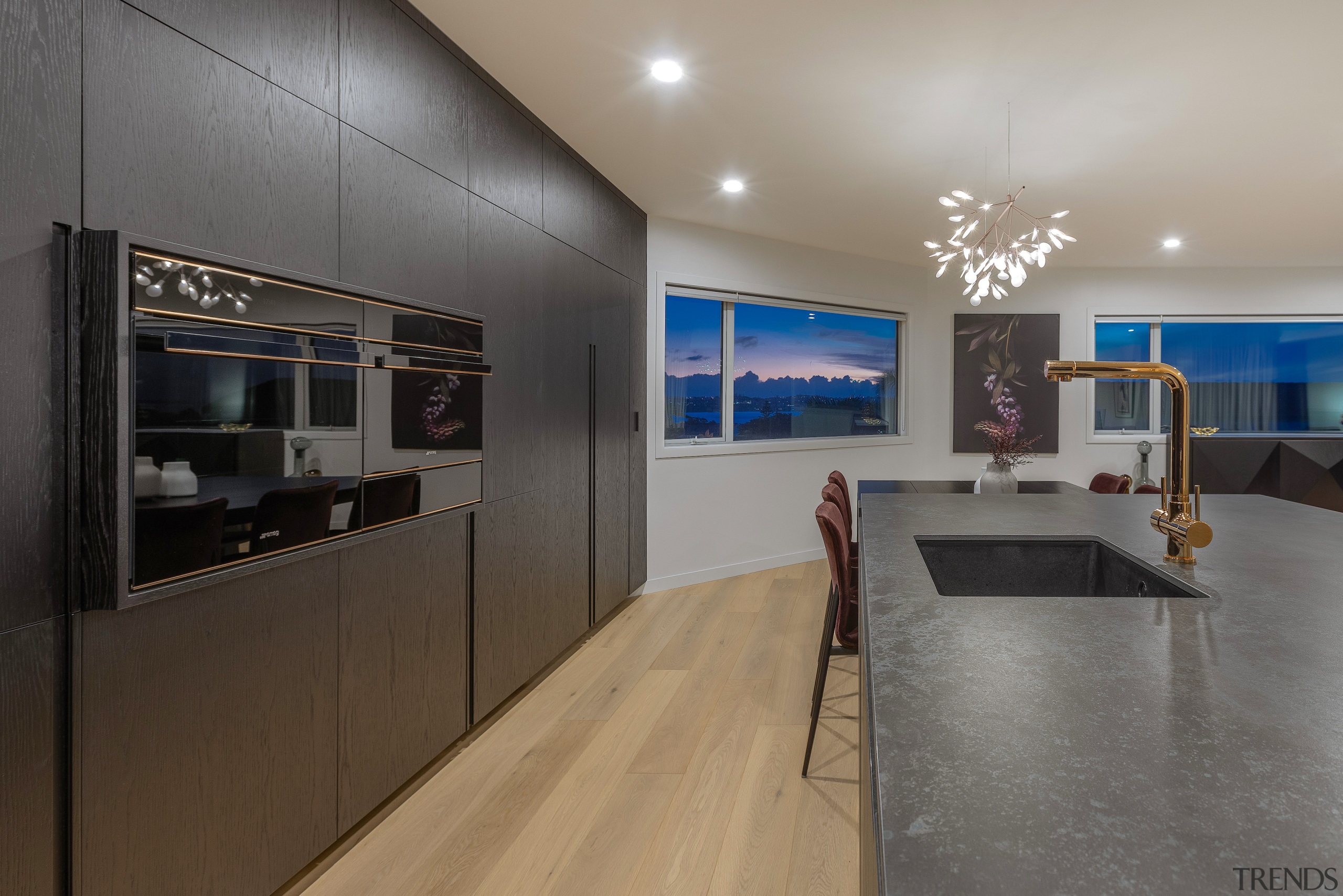 The dramatic yet minimalist kitchen doesn't detract from 