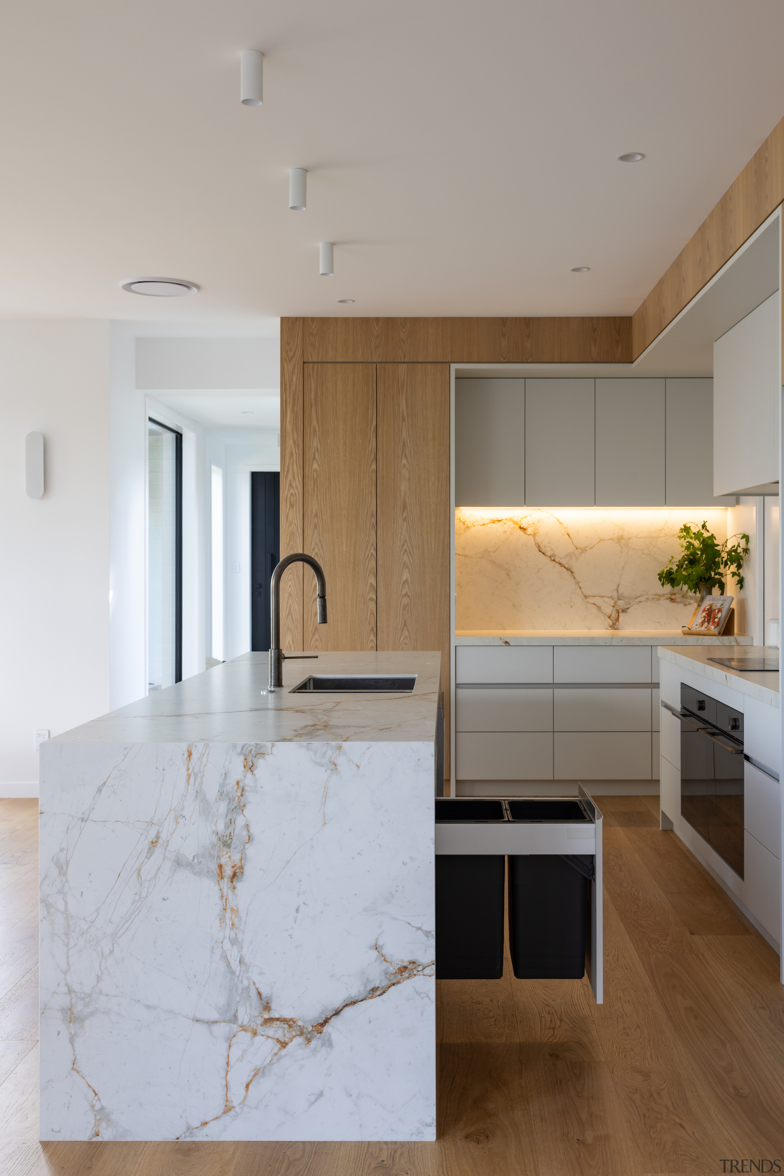 Waterfall ends add to the kitchen island's presence. 