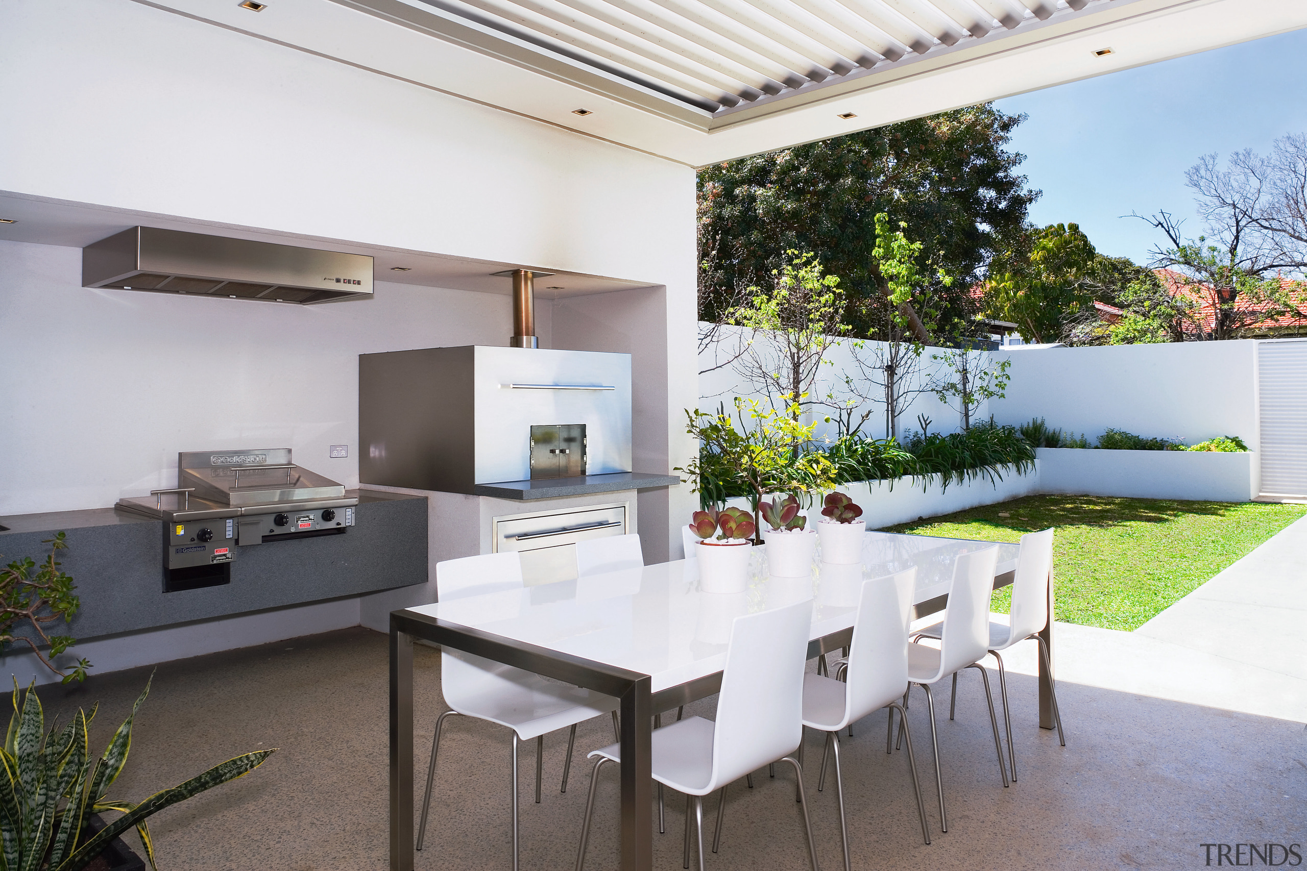 This outdoor kitchen is well equipped for entertaining architecture, daylighting, house, interior design, real estate, roof, table, white