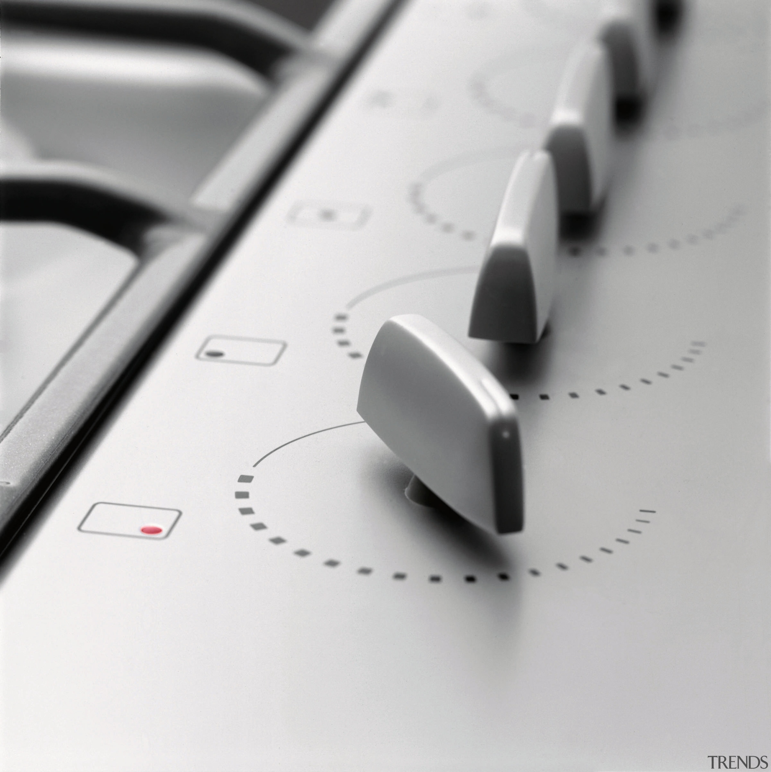 A close up view of the knobs on automotive design, font, product design, technology, white, gray