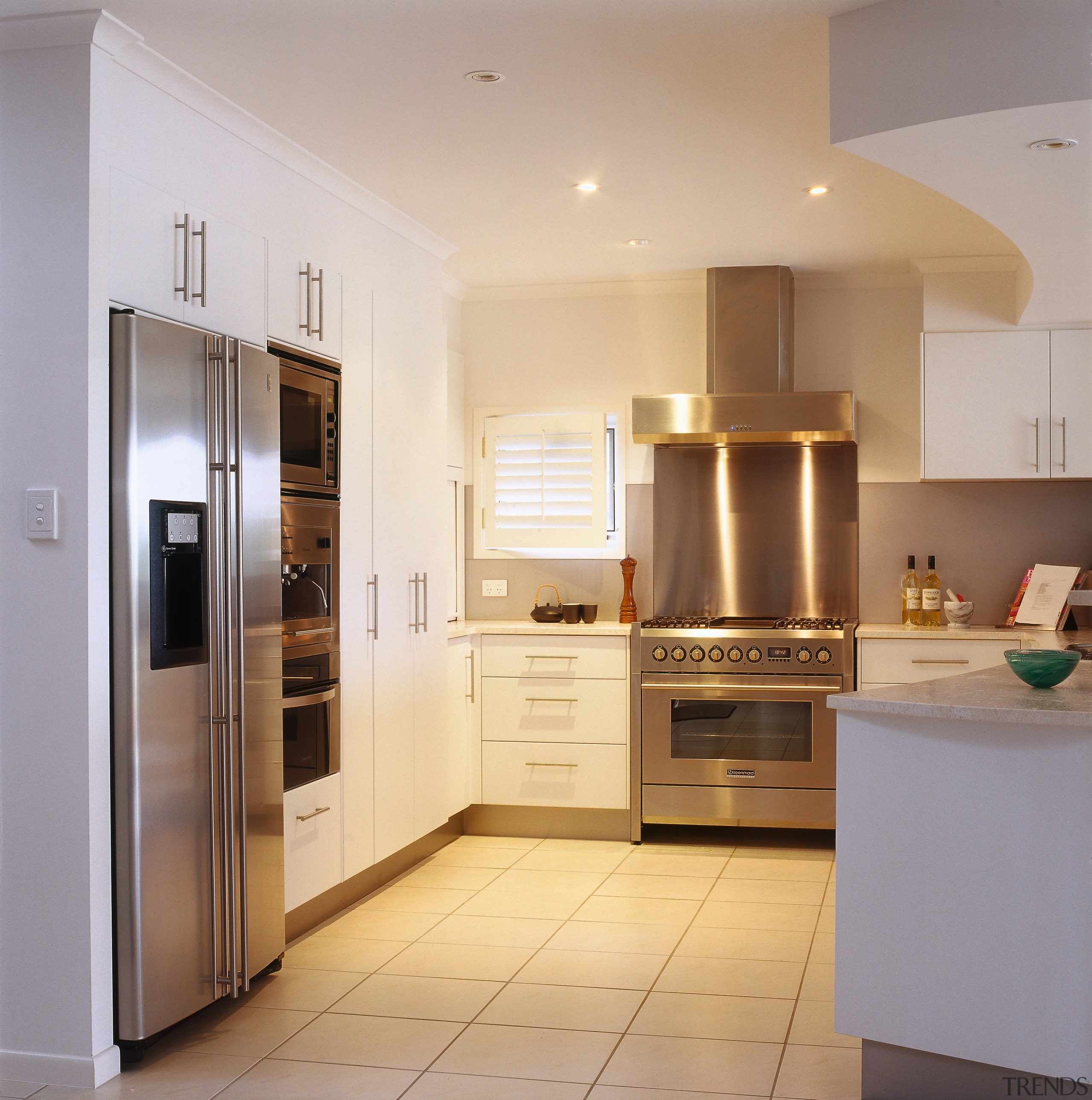 view of this kitchen featuring kleenmaid stainless steel cabinetry, countertop, cuisine classique, home appliance, interior design, kitchen, real estate, room, gray, orange