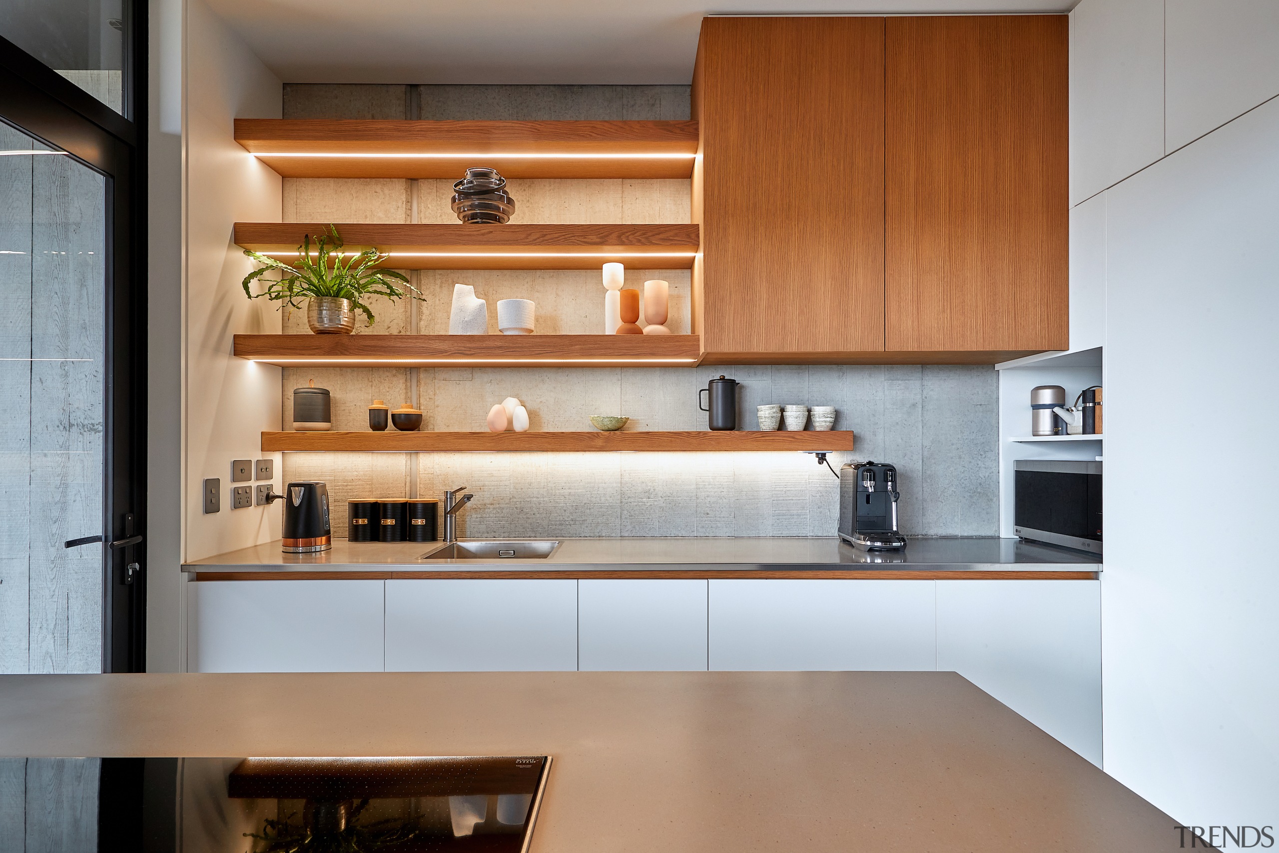 Discreet lighting sets off the architectural kitchen. 