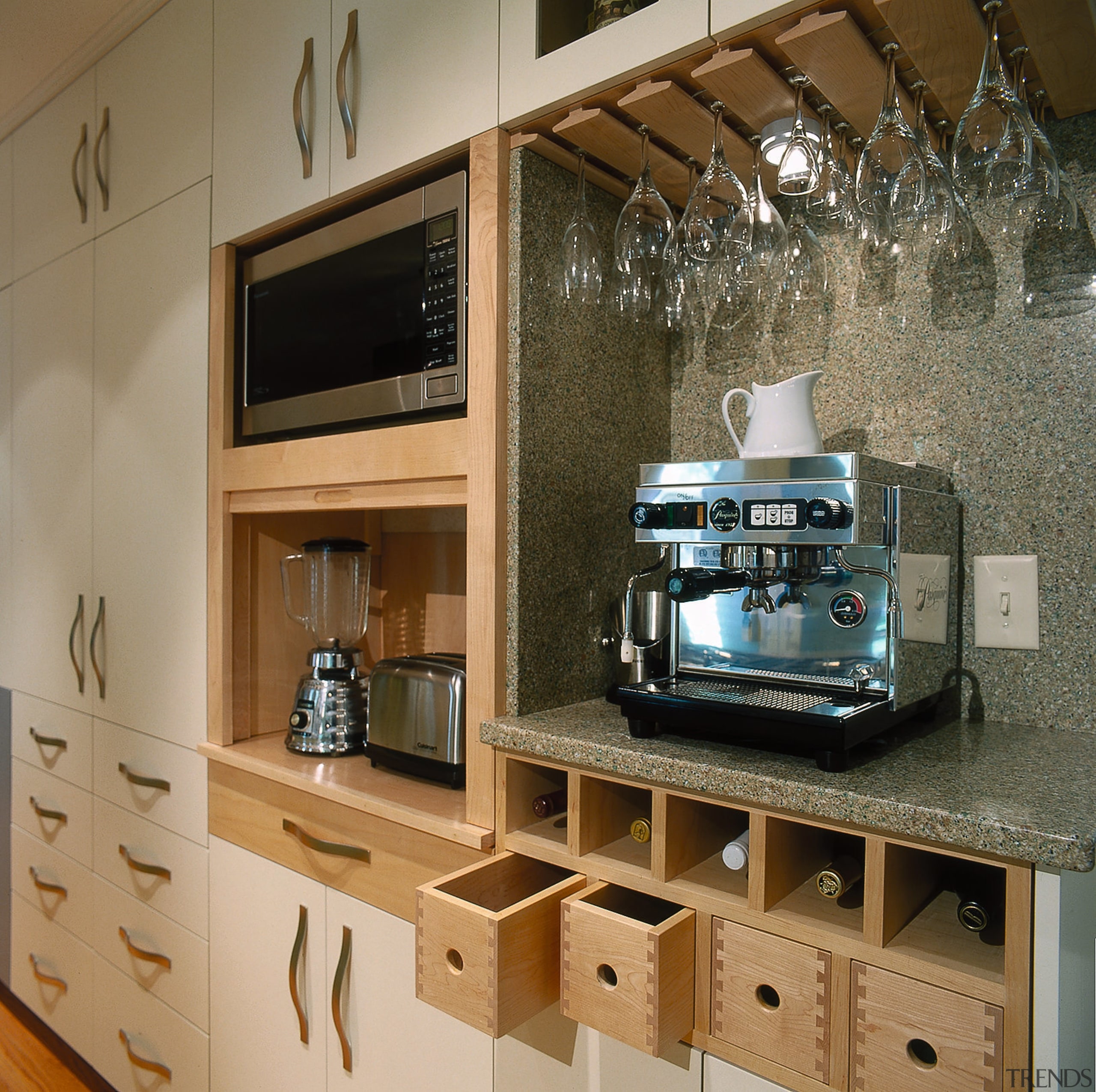 Kitchen designed for storage options. From left: pantry countertop, furniture, interior design, brown