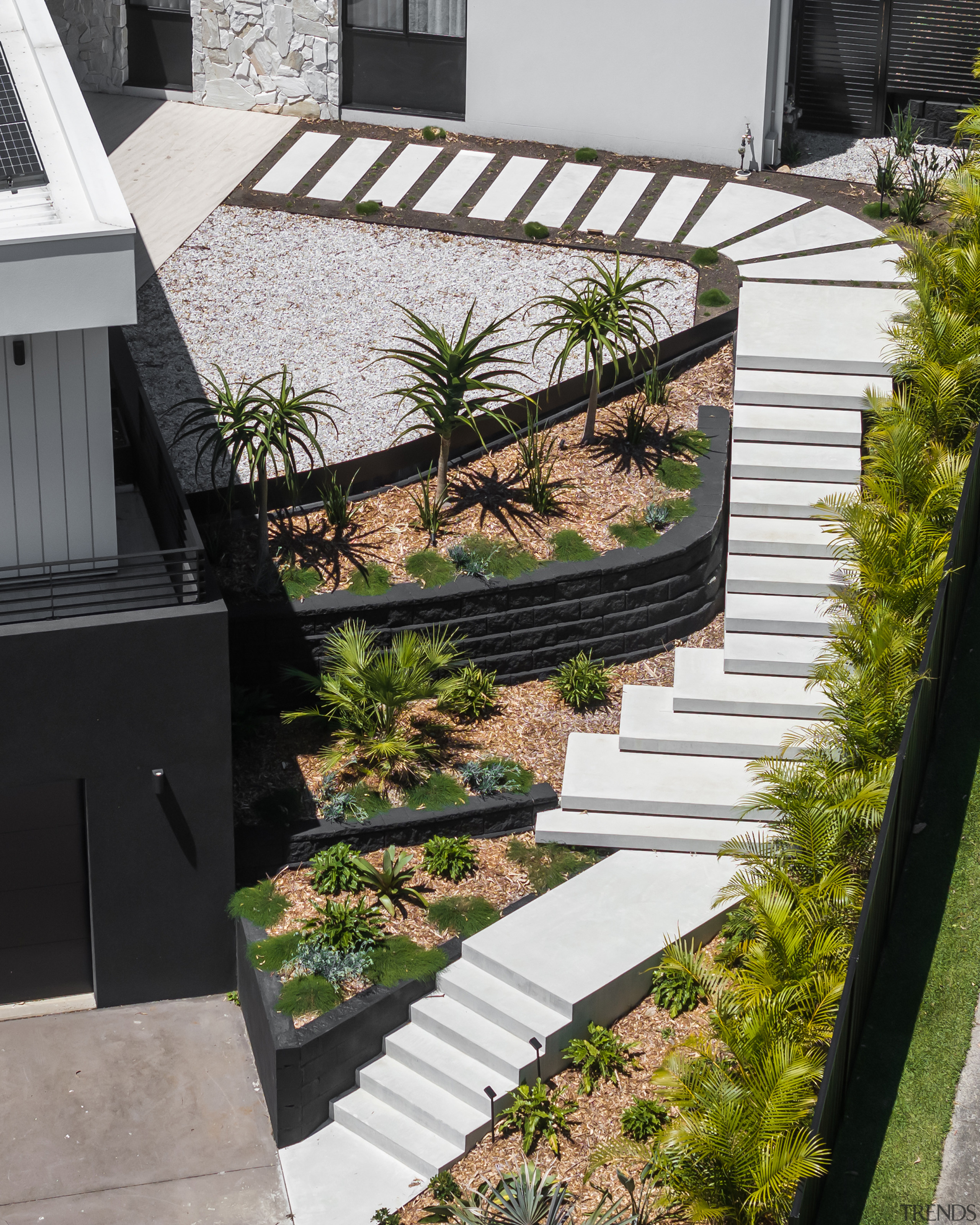 A cascade of white mid-century concrete steps takes 