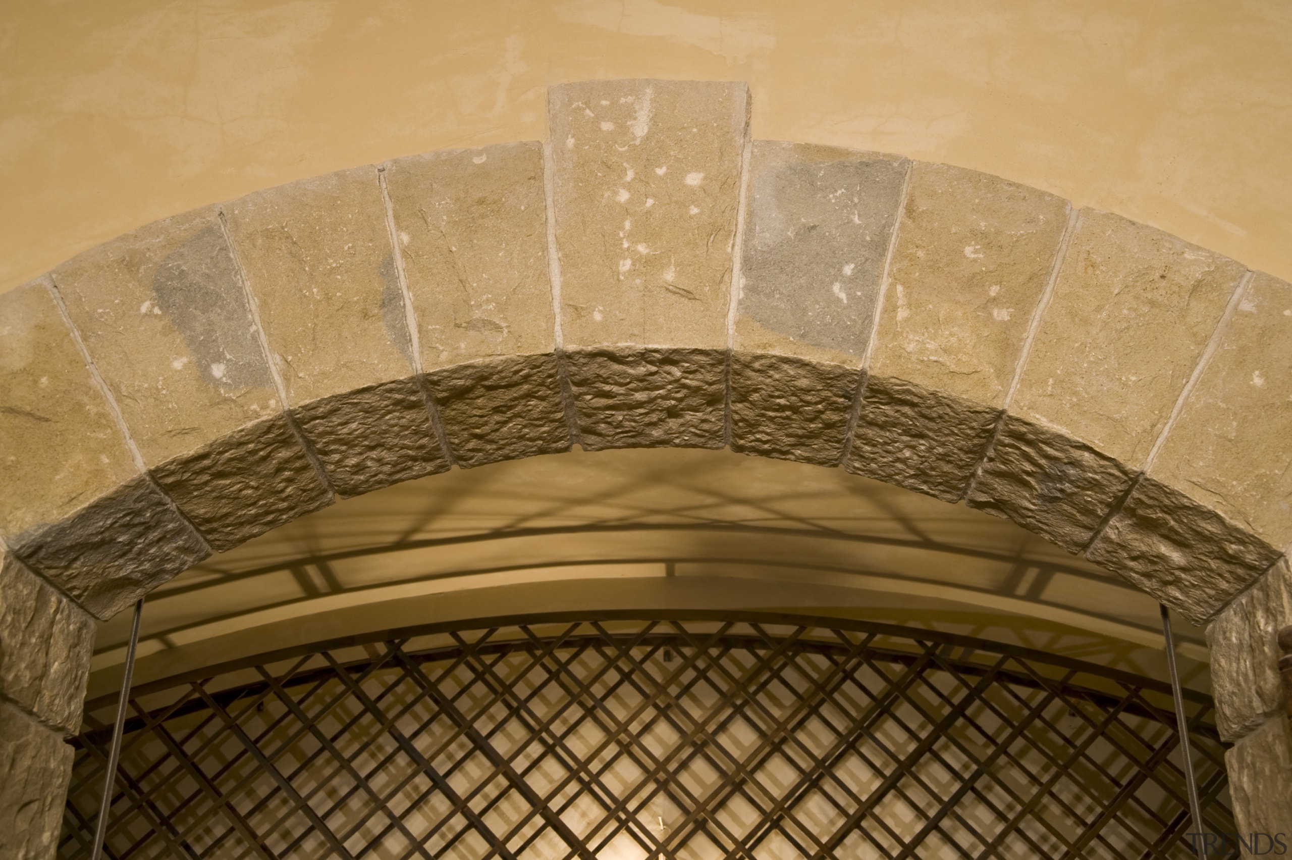 View of a wine cellar which features limestone arch, architecture, ceiling, daylighting, orange, brown