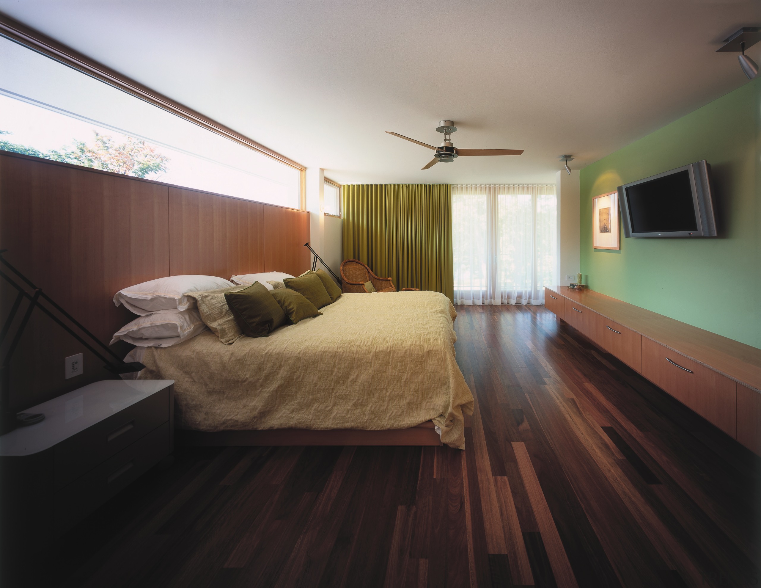 view of the bedroom featuring polished timber flooring, architecture, bed, bed frame, bedroom, ceiling, daylighting, floor, flooring, hardwood, home, house, interior design, laminate flooring, real estate, room, window, wood, wood flooring, black