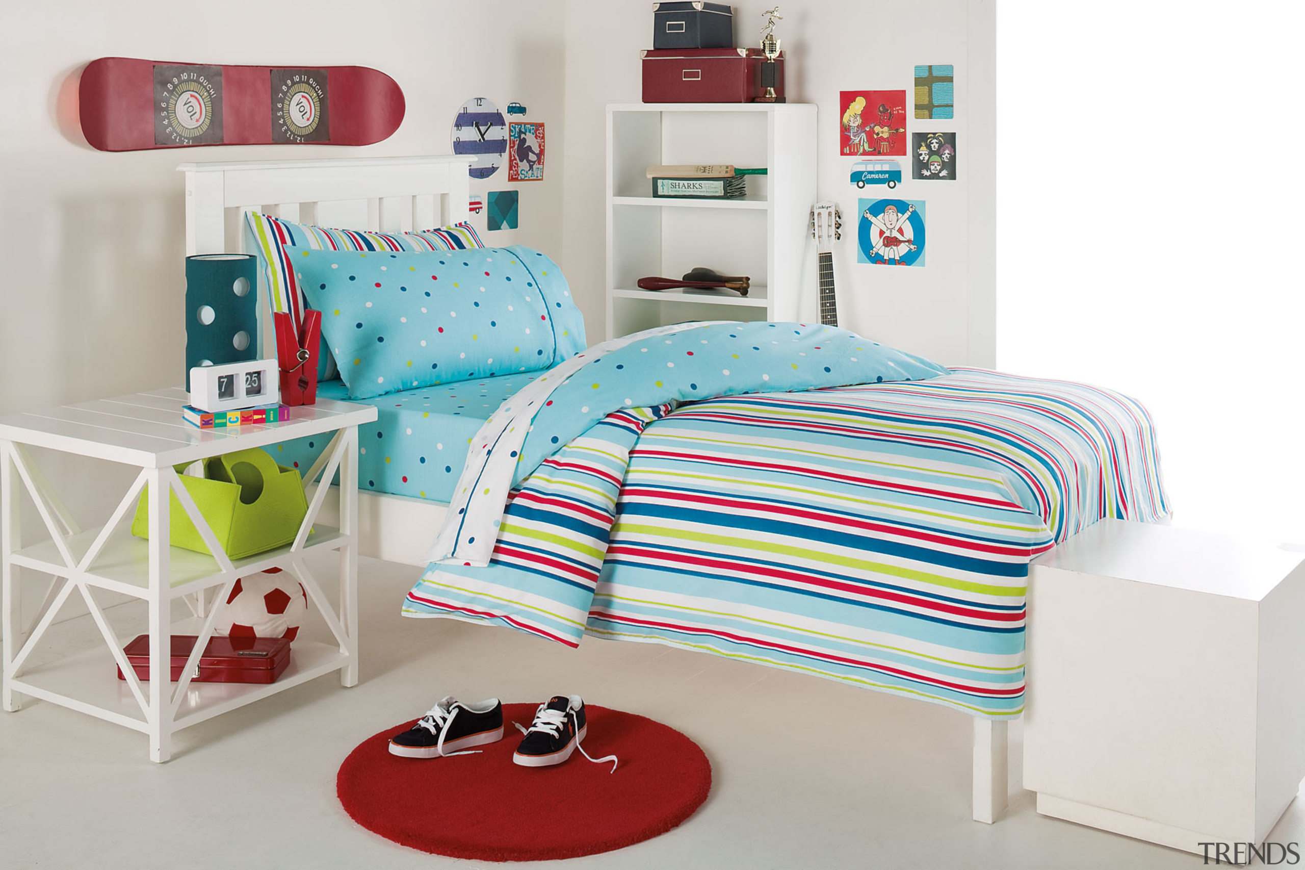 Child's bedroom with stripy colourful duvet and white bed, bed frame, bed sheet, bedding, duvet cover, furniture, linens, product, product design, textile, white