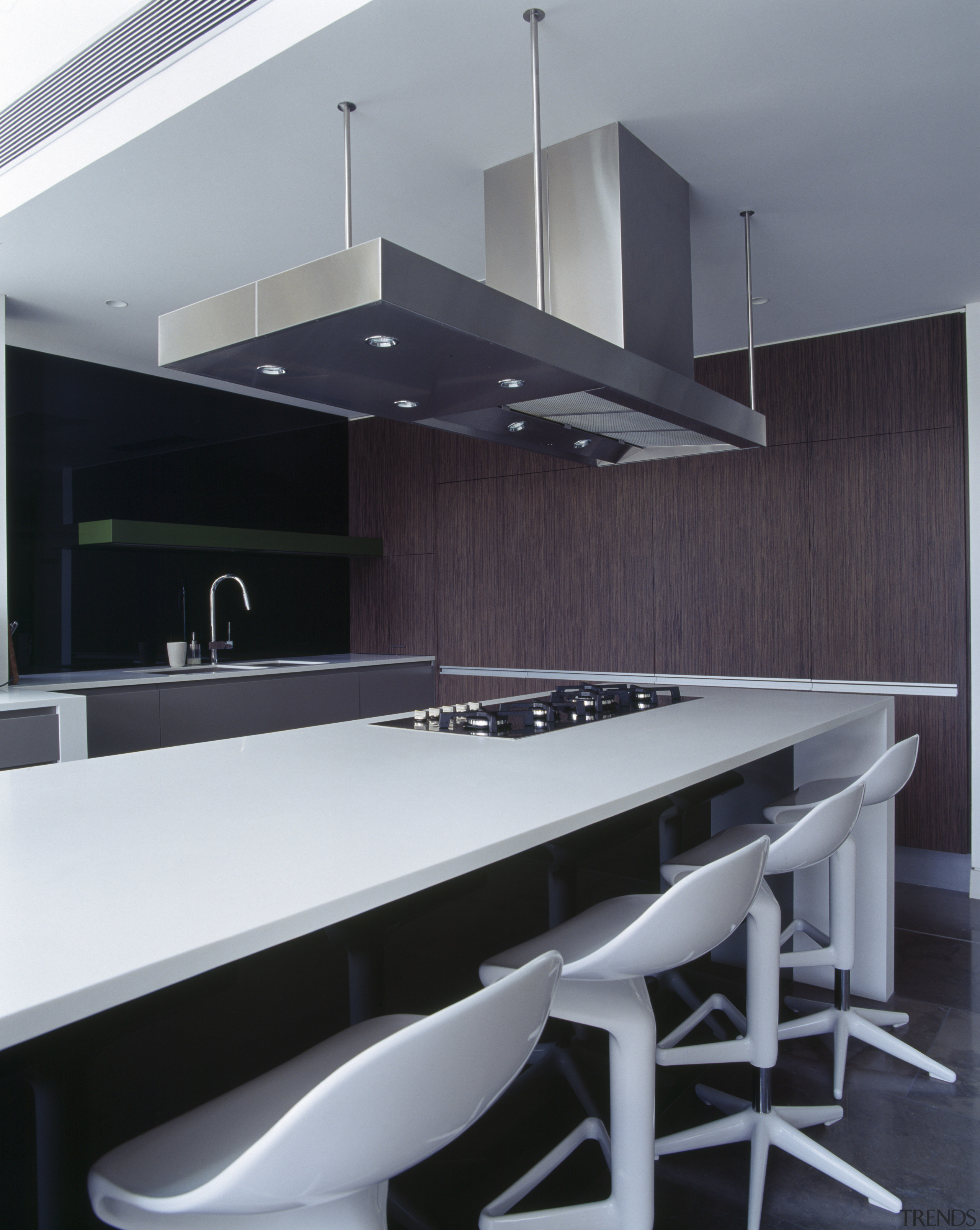 Halogens within the rangehood provide task lighting on architecture, countertop, house, interior design, kitchen, product design, table, gray, black