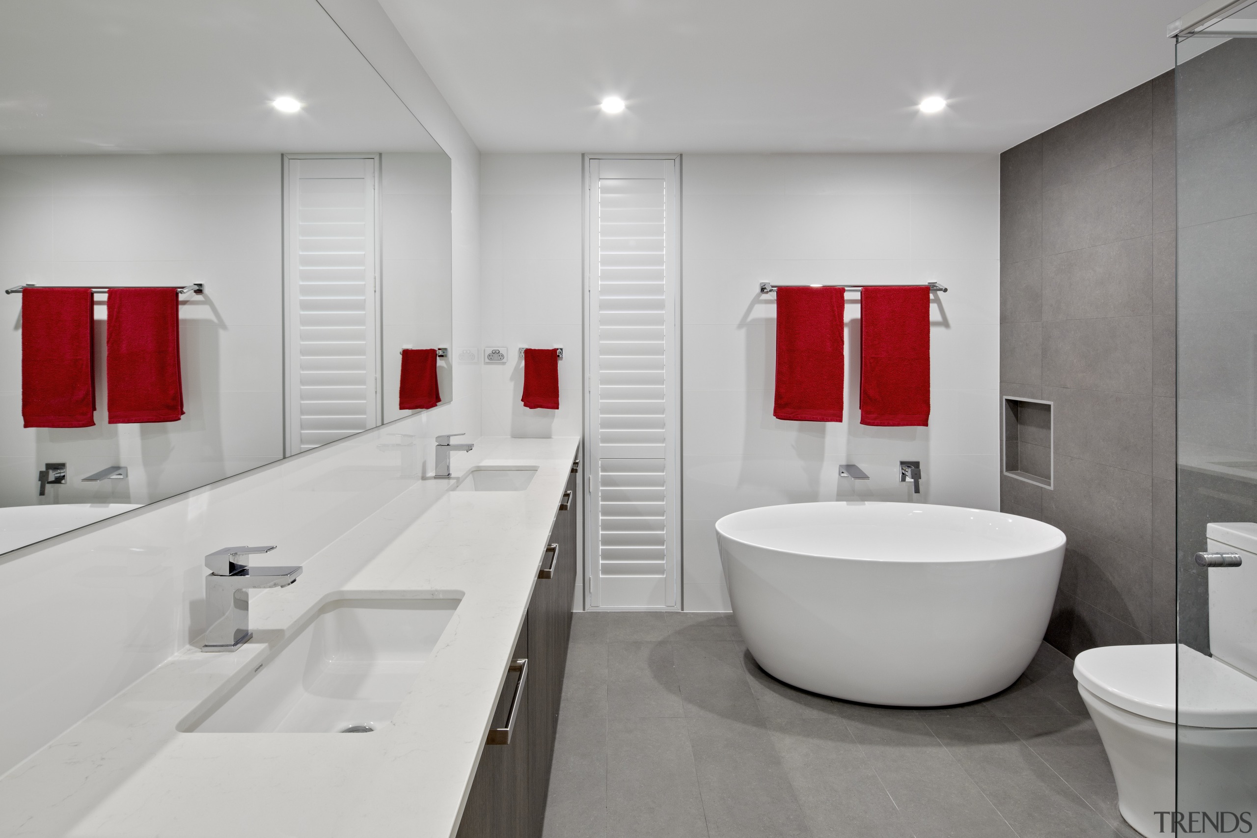 A clean white material palette sets off the architecture, bathroom, floor, interior design, plumbing fixture, product design, room, sink, tap, gray