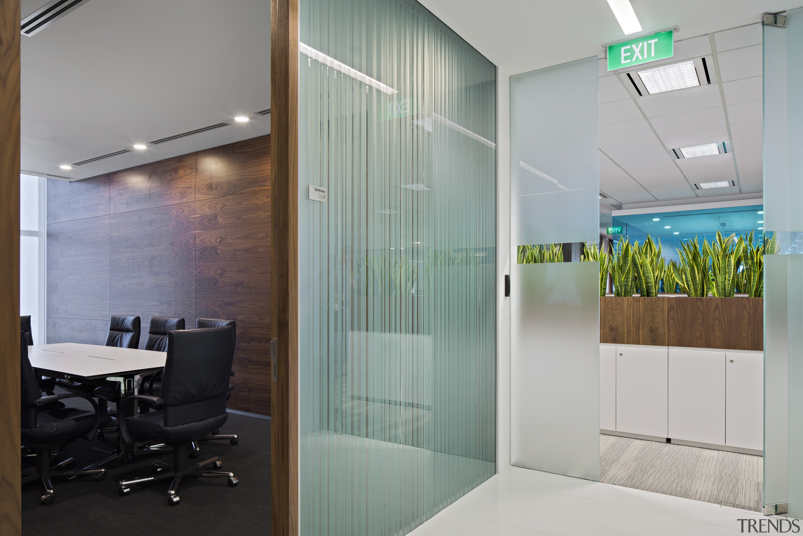 With its glossy white finishes and bold colour ceiling, door, glass, interior design, office, wall, gray