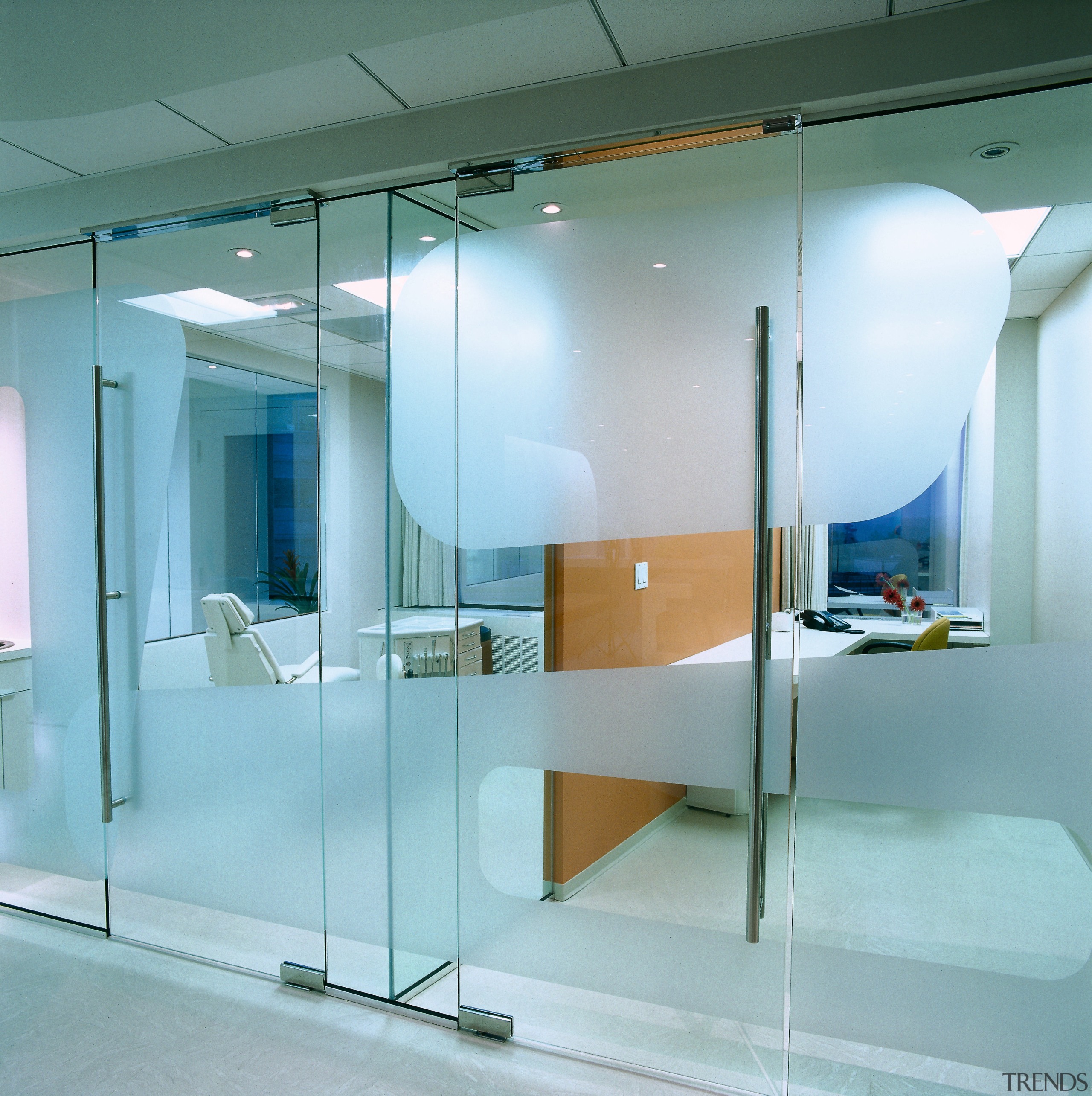A close up view of the glass screens. ceiling, glass, interior design, product design, wall, teal, gray