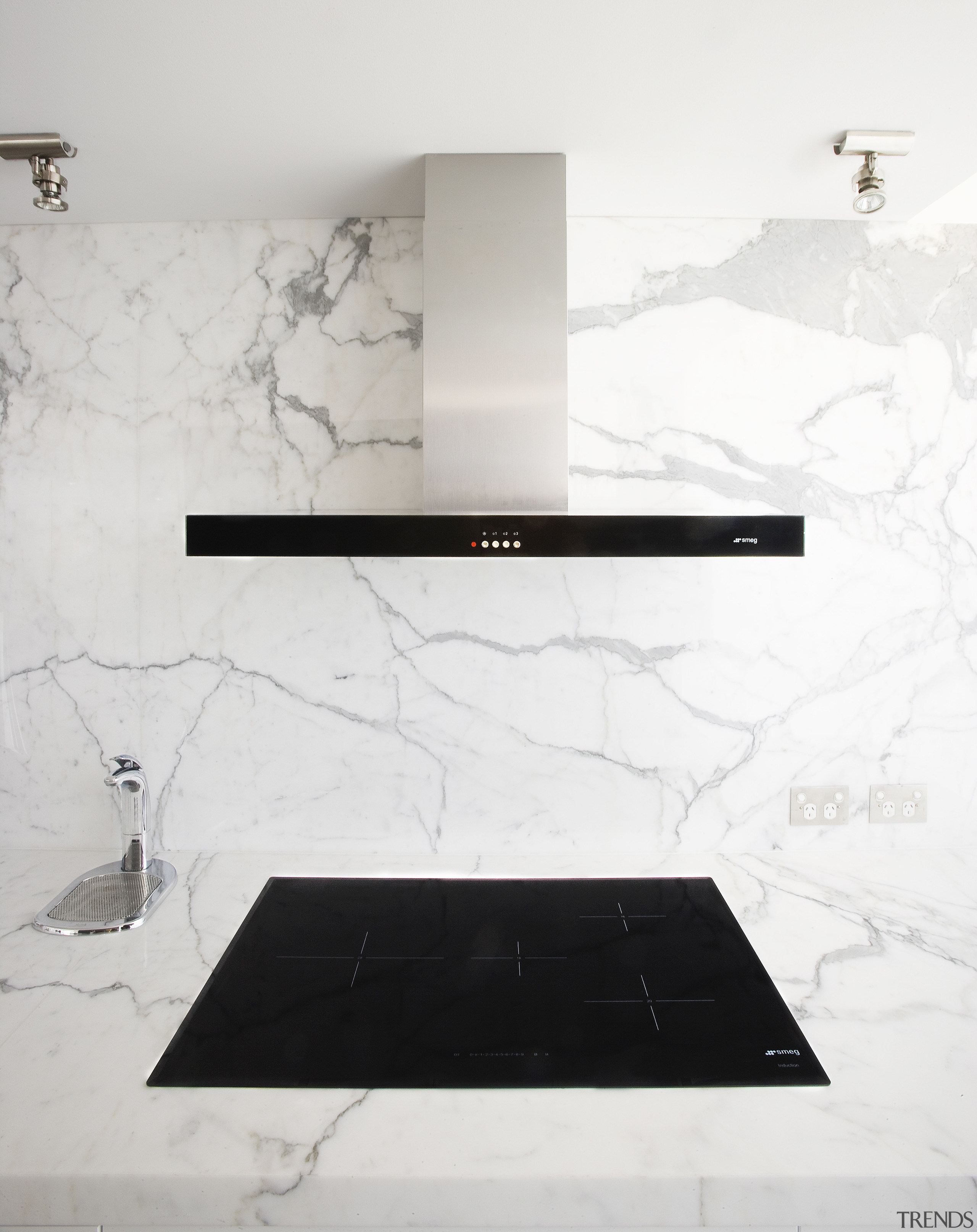 View of contemporary hood and cooktop with light black and white, floor, furniture, product design, table, wall, white