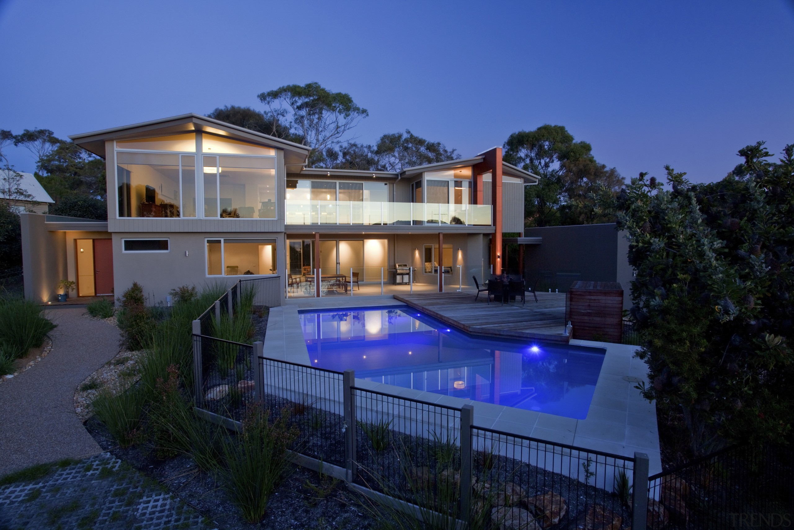 This home was designed and built by Graeme architecture, backyard, elevation, estate, facade, home, house, lighting, property, real estate, residential area, resort, swimming pool, villa, blue, black