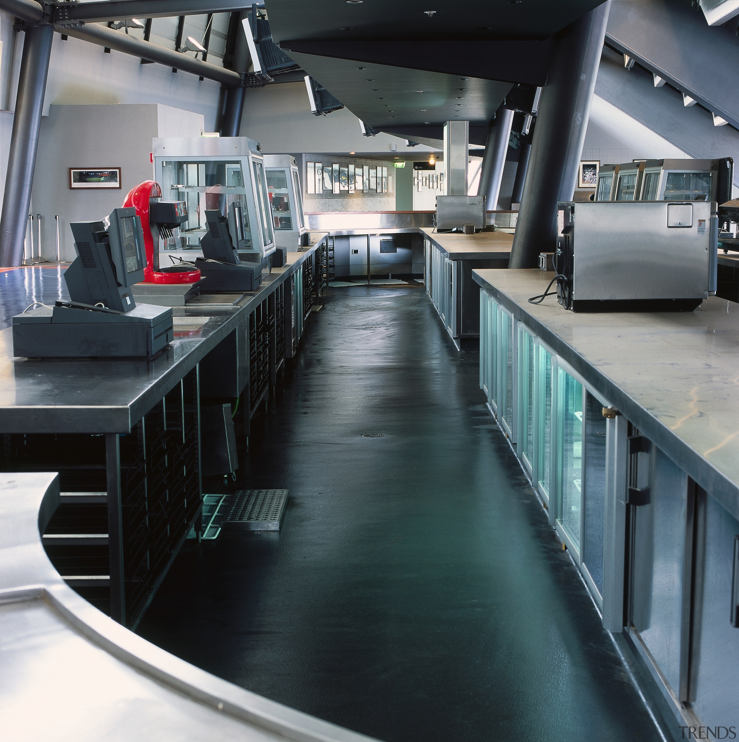 Bar and kitchen hospitality area featuring vinyl flooring. floor, black, gray