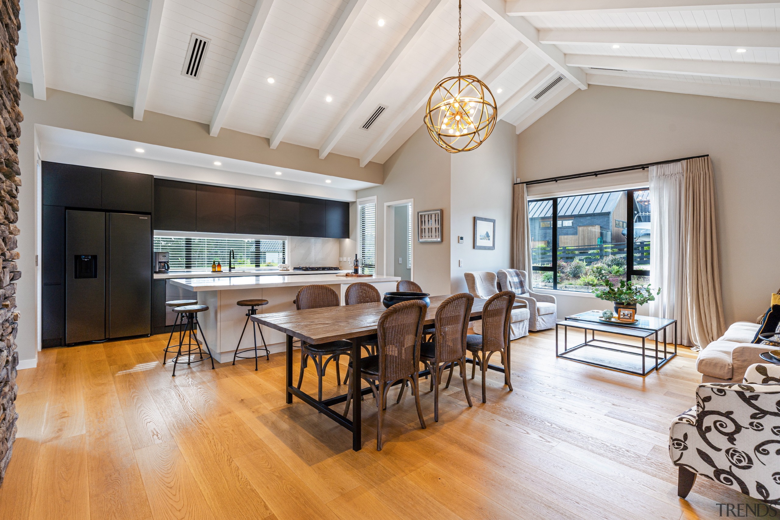 The dining/sitting/kitchen area is spacious with a soaring 