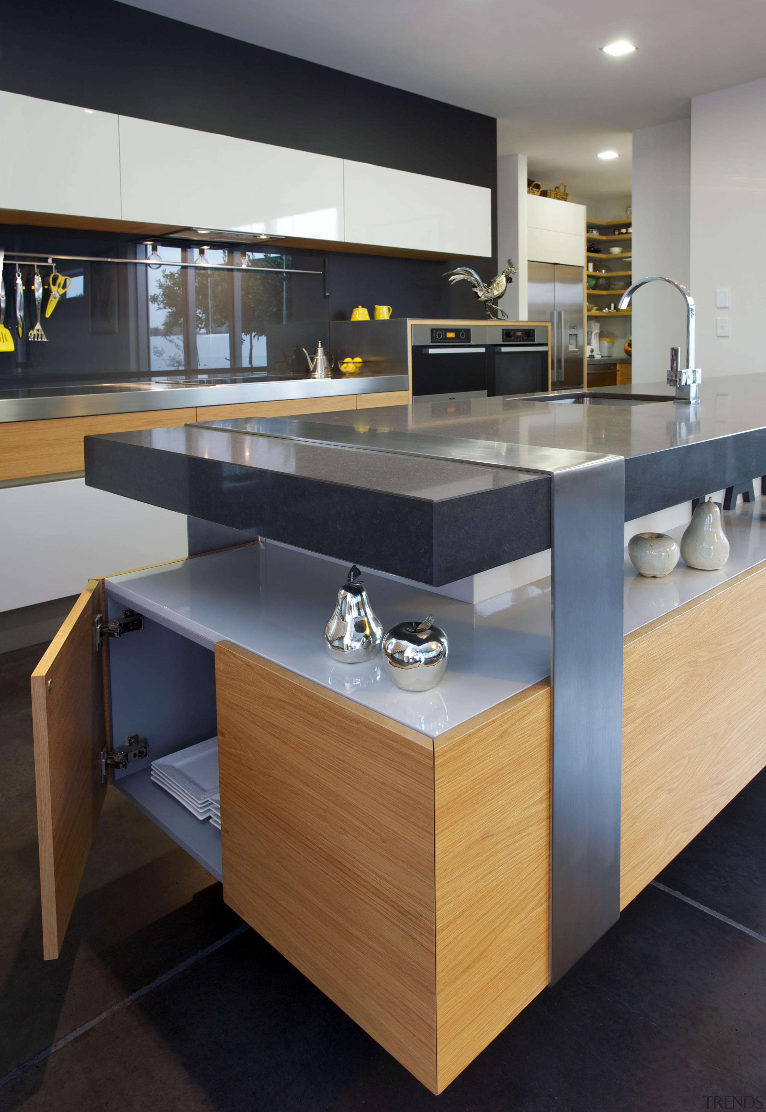 This kitchen designed by Melanie Craig Design features countertop, floor, furniture, interior design, kitchen, product design, table, black