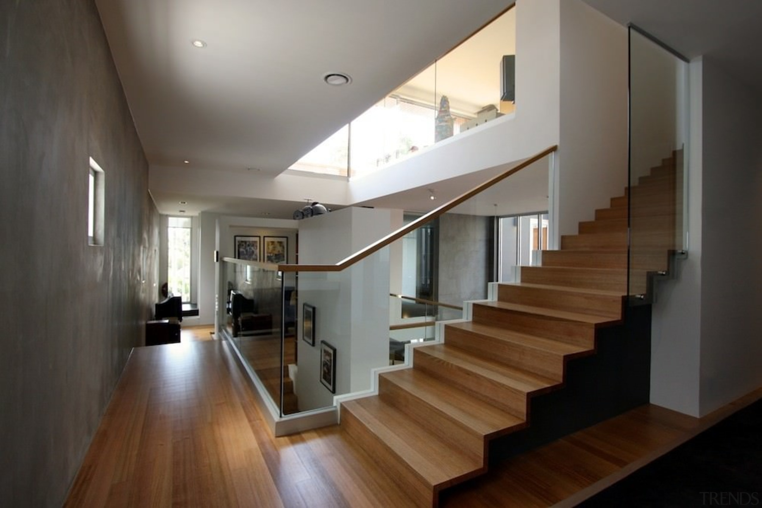 Wood, concrete and glass create an interesting space architecture, ceiling, daylighting, floor, flooring, handrail, hardwood, house, interior design, lobby, property, real estate, stairs, wood flooring, gray, black, brown