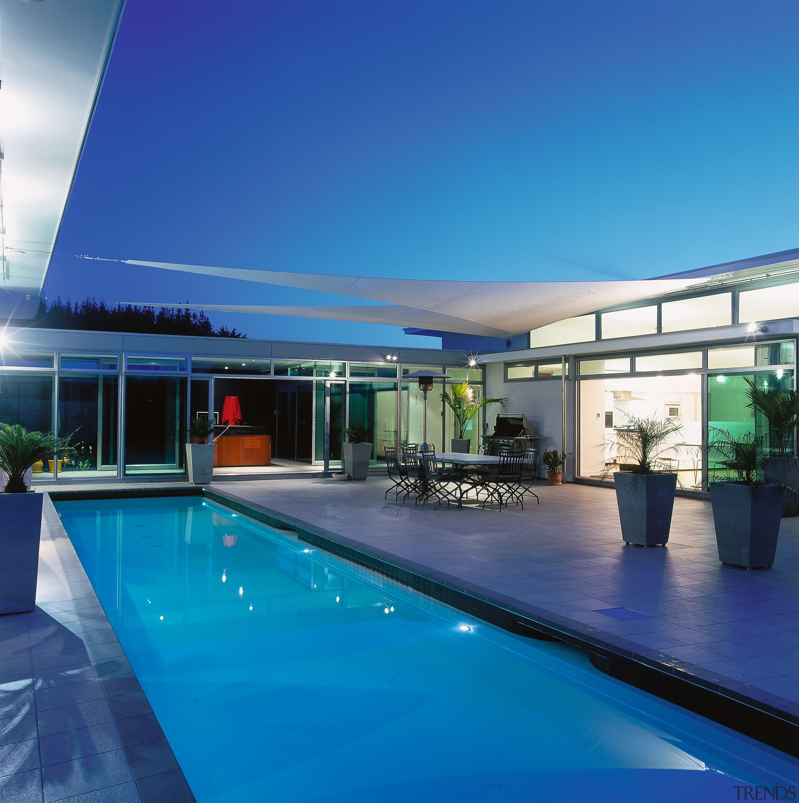 Pool and patio area in front of house architecture, condominium, estate, home, house, leisure, leisure centre, property, real estate, roof, sky, swimming pool, water, blue, teal