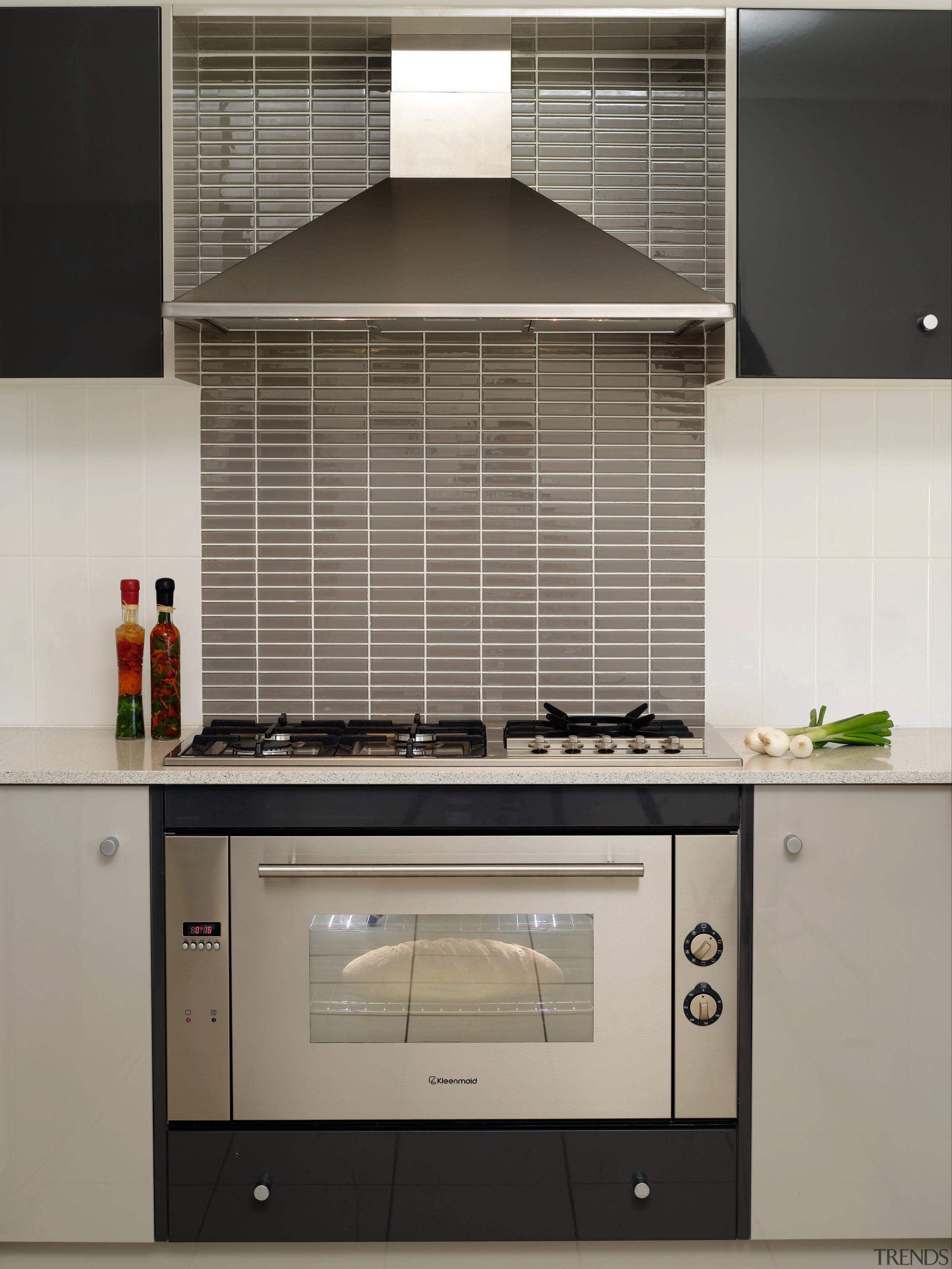 Authentic detailing on the architecture is matched by cabinetry, countertop, home appliance, interior design, kitchen, kitchen appliance, kitchen stove, oven, gray, black