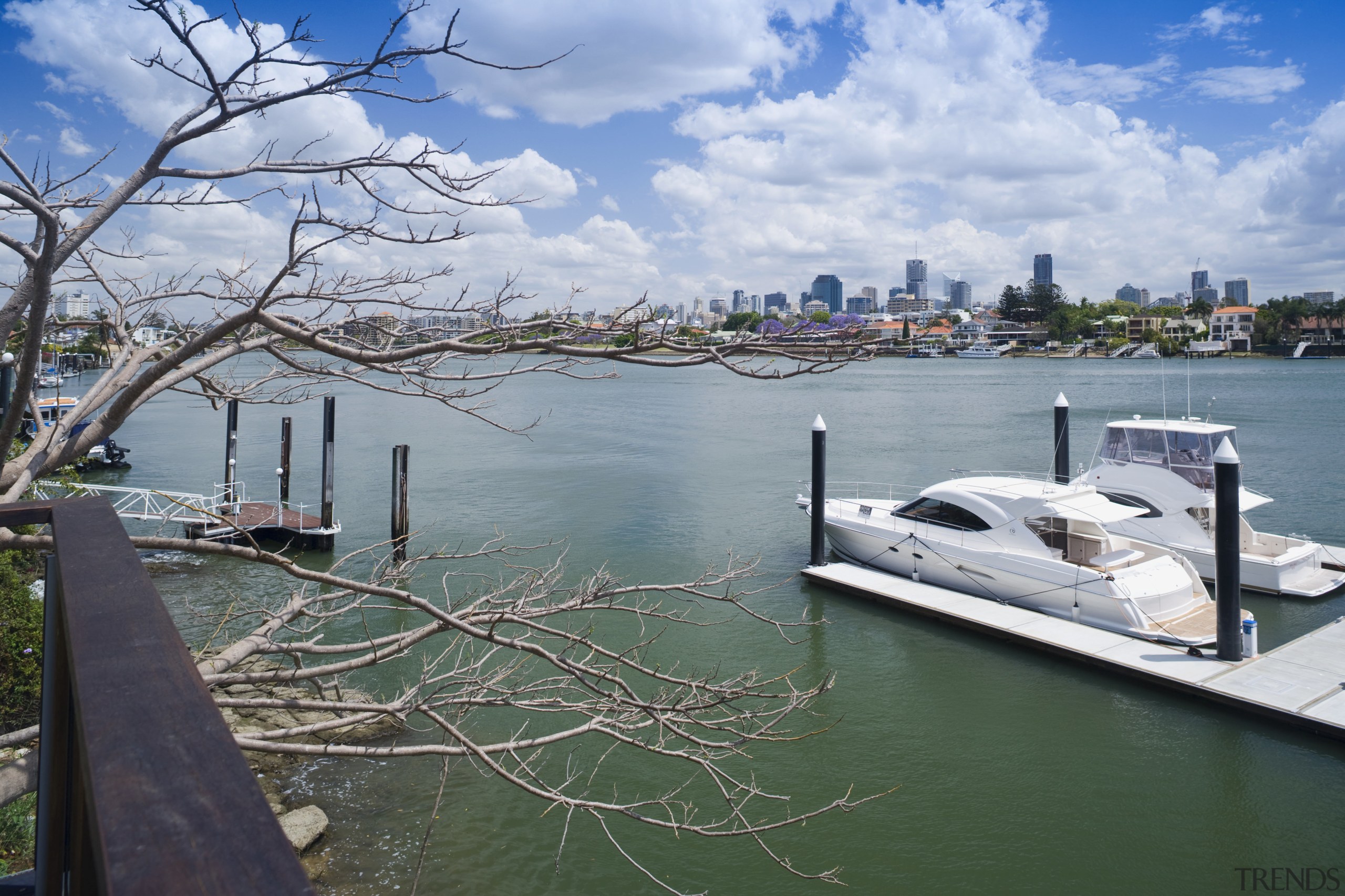 View of the Norman Reach development which is boat, city, dock, lake, marina, plant, river, sky, tree, water, water transportation, waterway, gray
