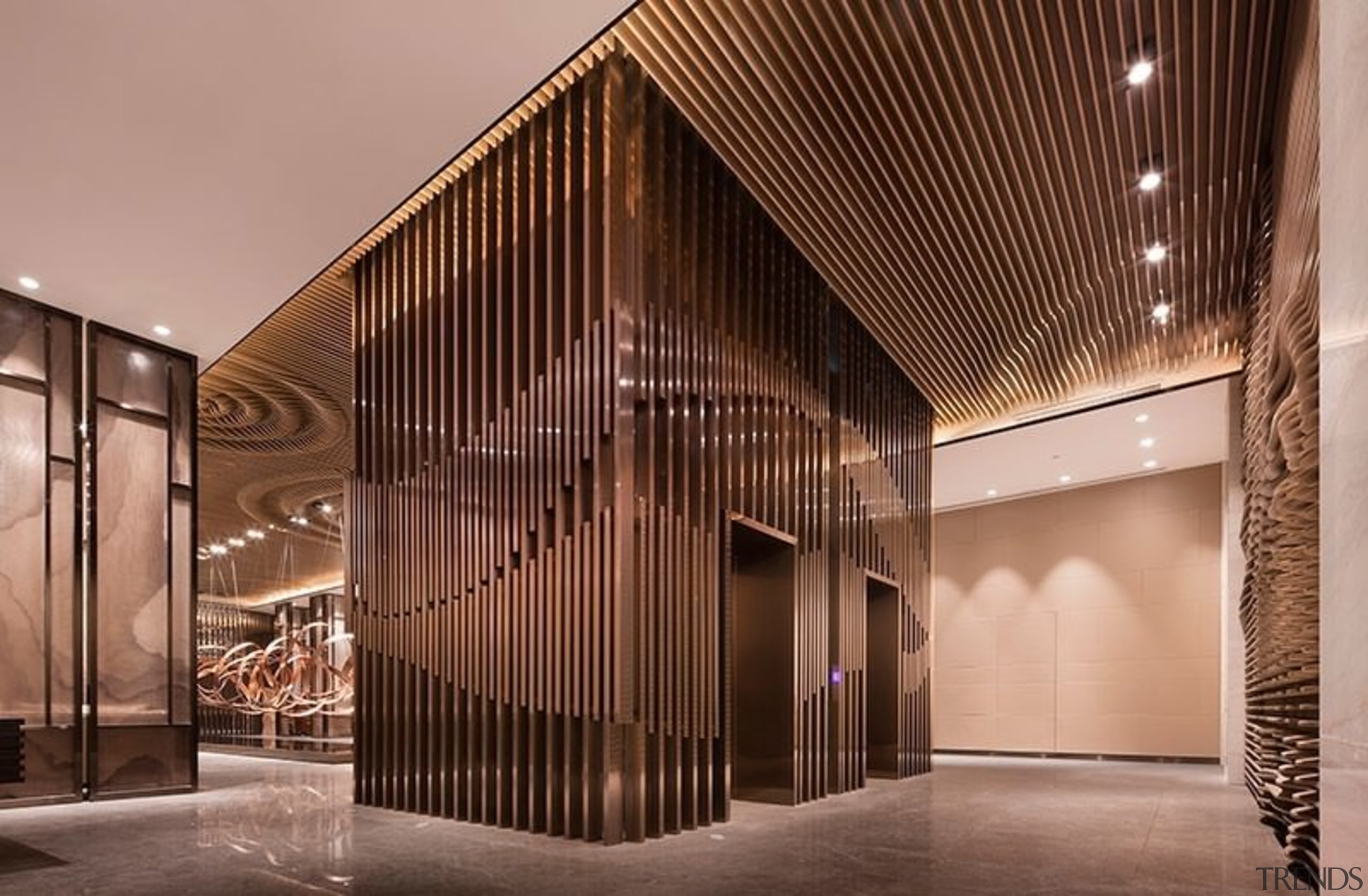 Slats run around this elevator and along the architecture, ceiling, facade, interior design, lobby, brown, orange