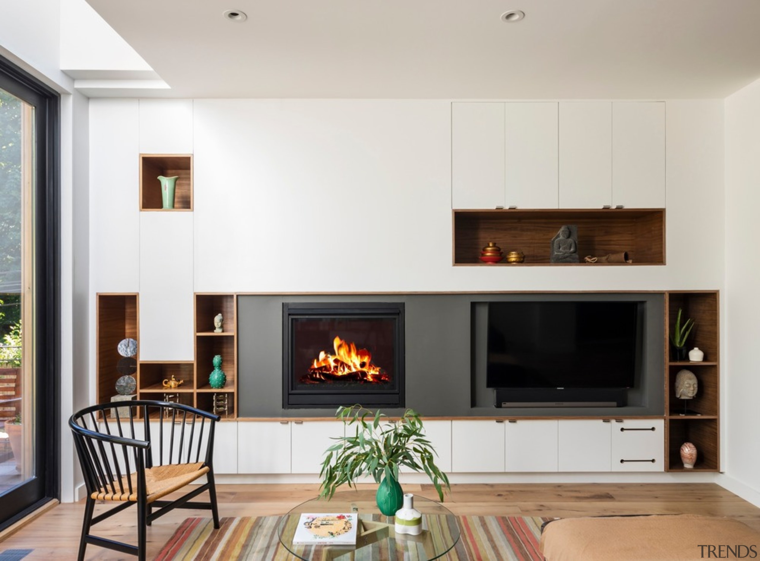 Living room 1 - building | ceiling | building, ceiling, fireplace, floor, furniture, hearth, heat, home, house, interior design, living room, property, room, table, wood flooring, wood-burning stove, white