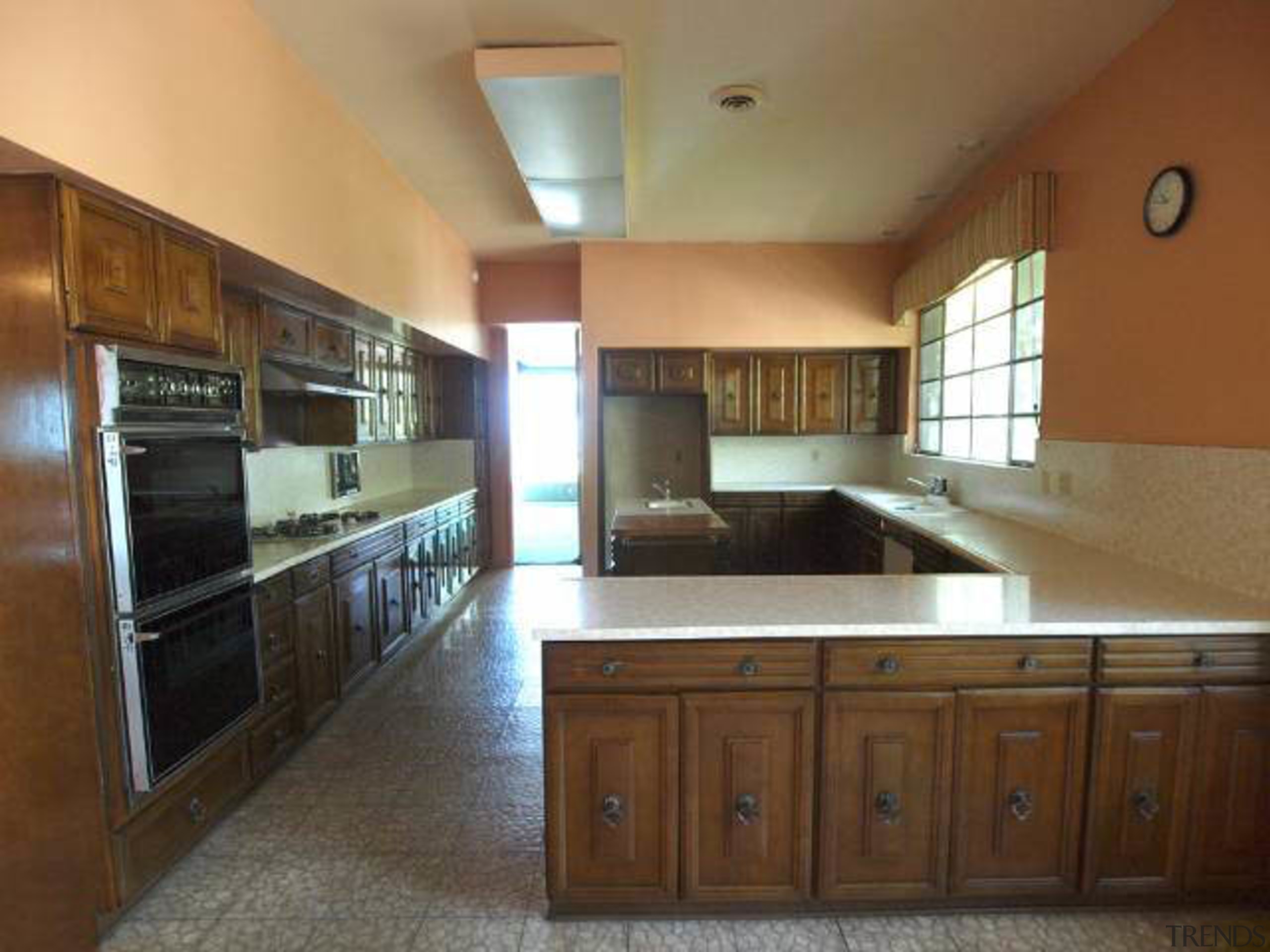 Before a remodel by Xten Architecture, the original cabinetry, countertop, cuisine classique, estate, home, interior design, kitchen, property, real estate, room, brown