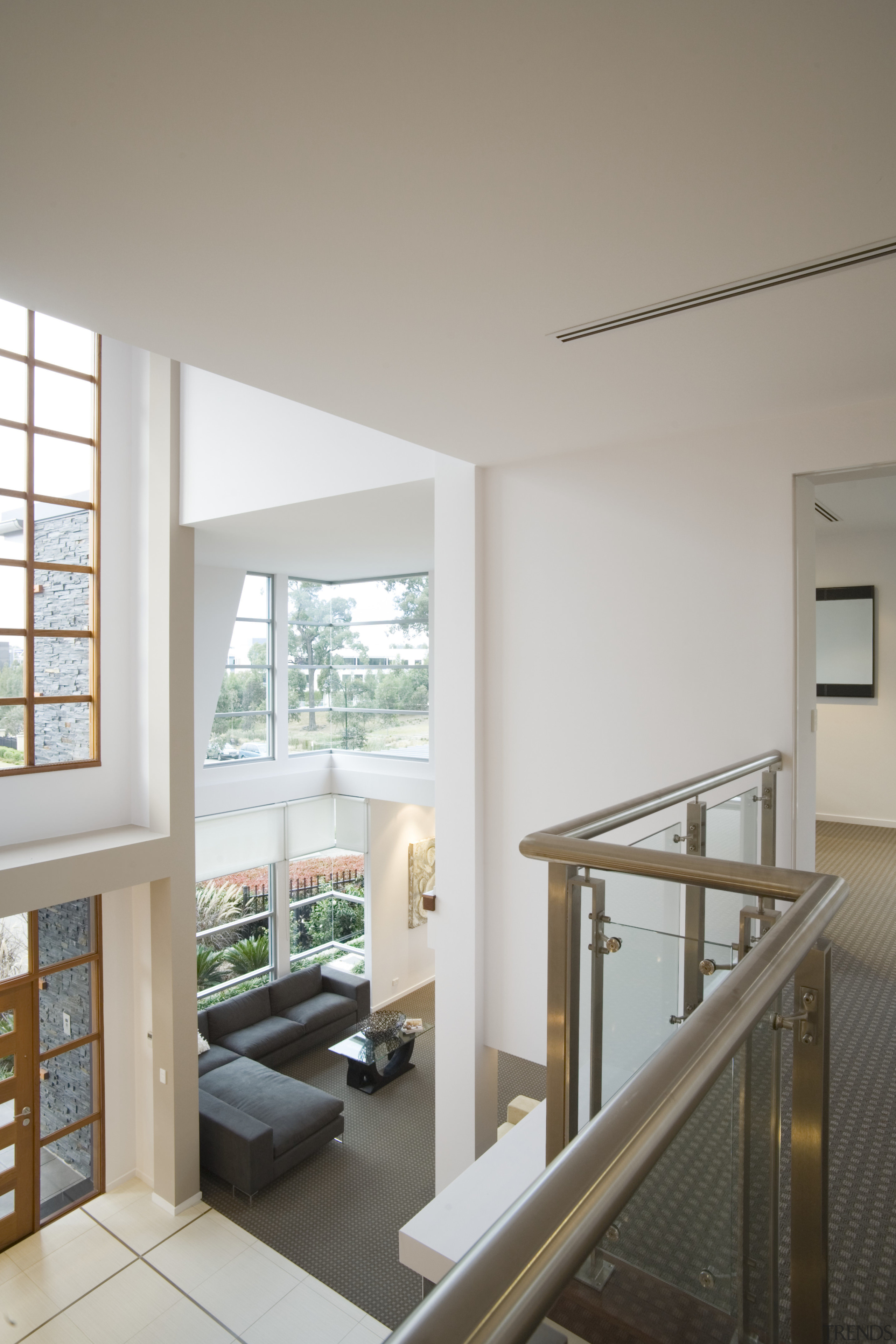 Interior view from the upper level of a architecture, daylighting, floor, handrail, home, house, interior design, living room, real estate, window, gray