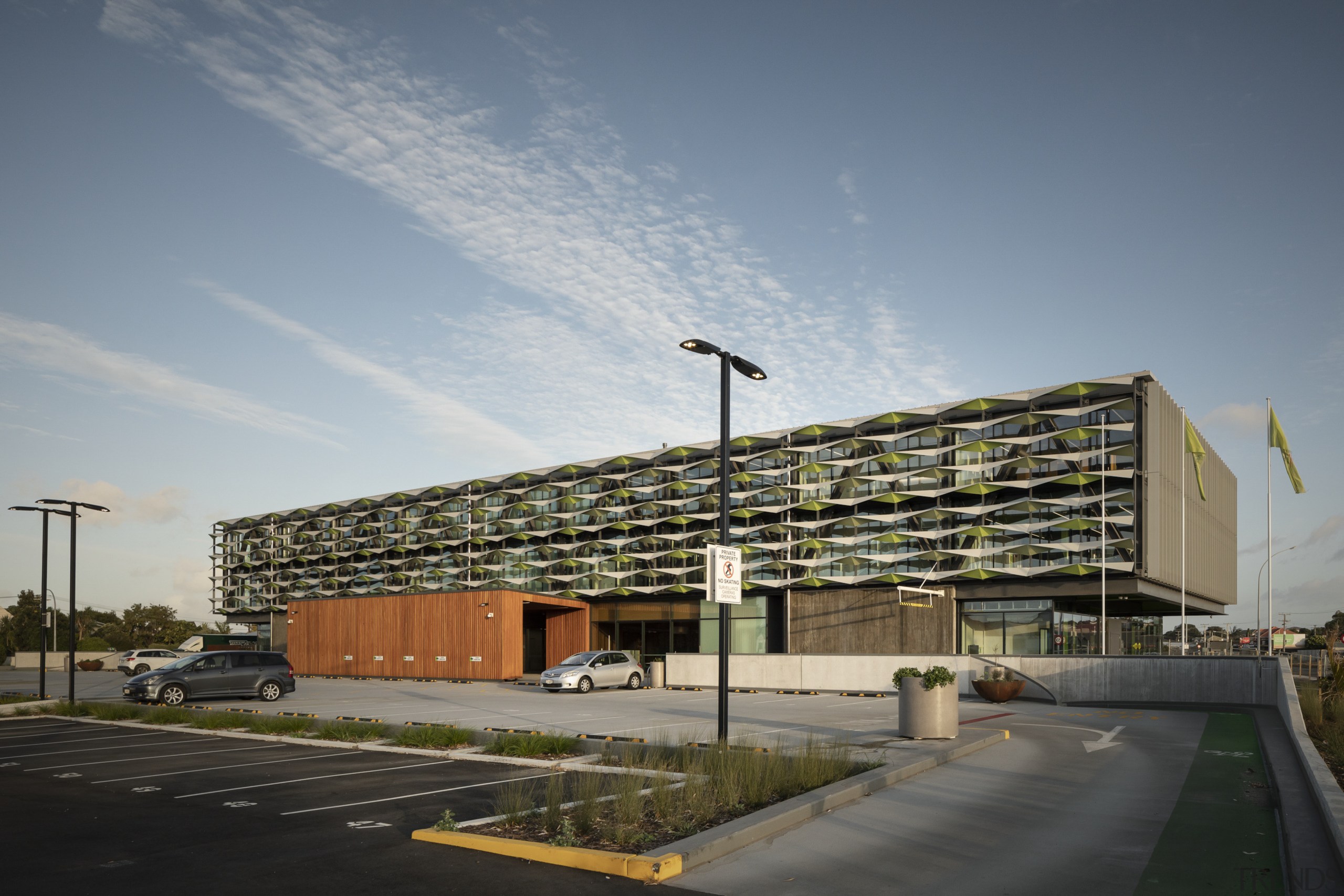 The wood-clad form of the porte cochère entry 